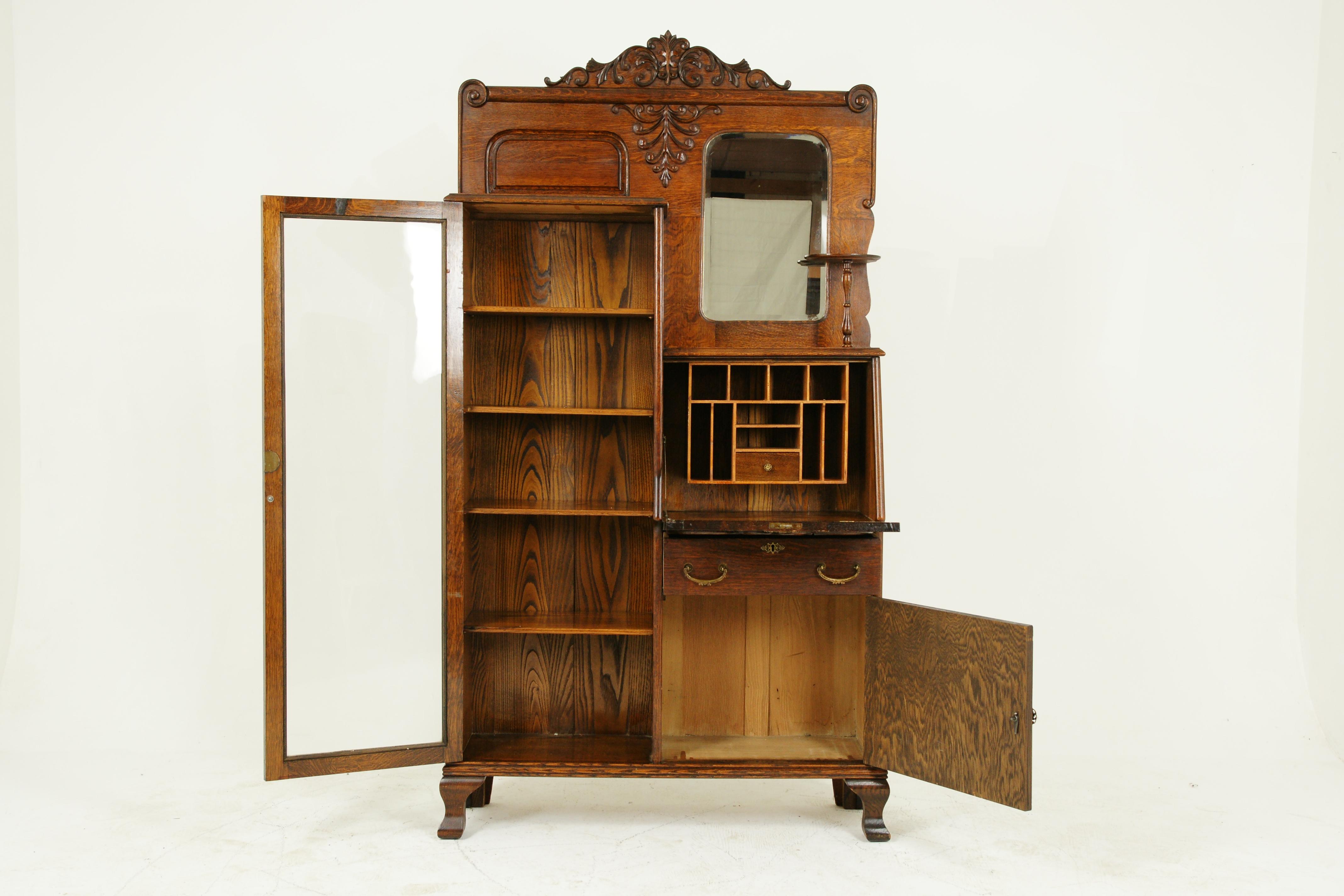 Antique secretary desk, antique bookcase, oak, Canada, 1900, antique furniture

Canada, 1900
Solid oak construction
All original finish
Carved pediment top
Rectangular beveled mirror, single shelf to the right
Tiger oak fall front