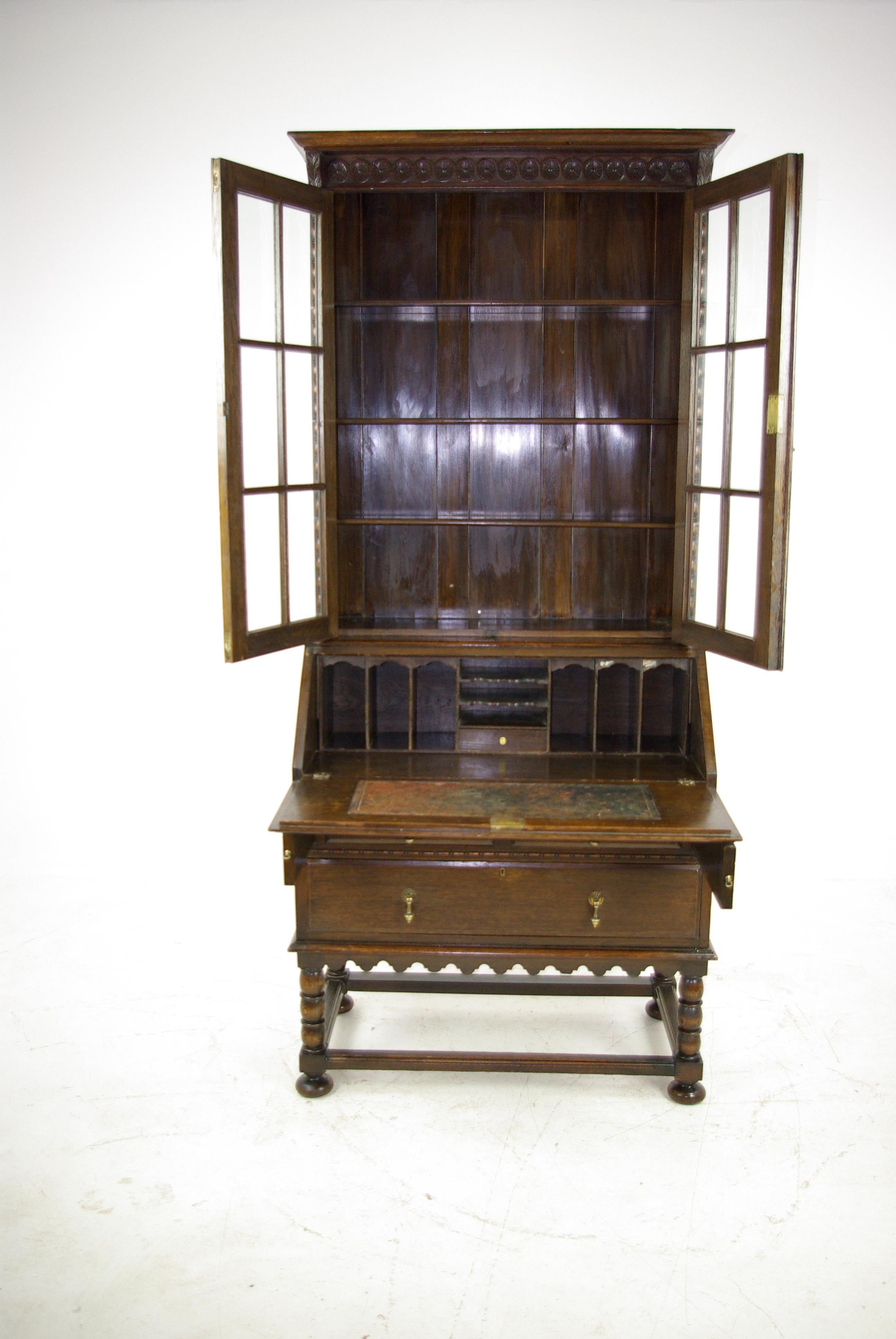 Secretary desk, antique fall front desk, oak bookcase, Scotland, 1920, antique furniture.

Scotland, 1920
Carved oak cornice with rosettes above
Upper section with two glass doors
Enclosed with three adjustable shelves
Lower section with drop