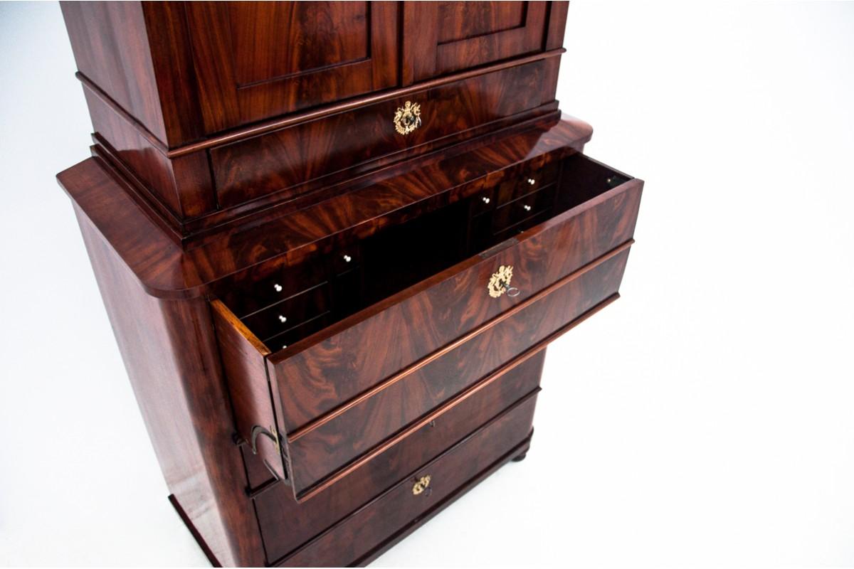 Impressive secretary from the mid-19th century in Biedermeier style. Antique furniture with a more beautiful form will add elegance to any interior. A representative piece of furniture focused on functionality. When opened, serves as a desk top,