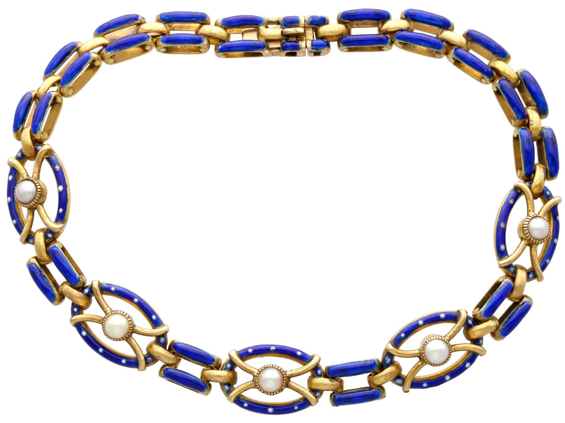 A stunning, fine and impressive antique seed pearl and hot enamel, 21 karat yellow gold gate bracelet; part of our diverse antique jewelry collections.

This stunning antique Victorian bracelet has been crafted in 21k yellow gold.

The five oval