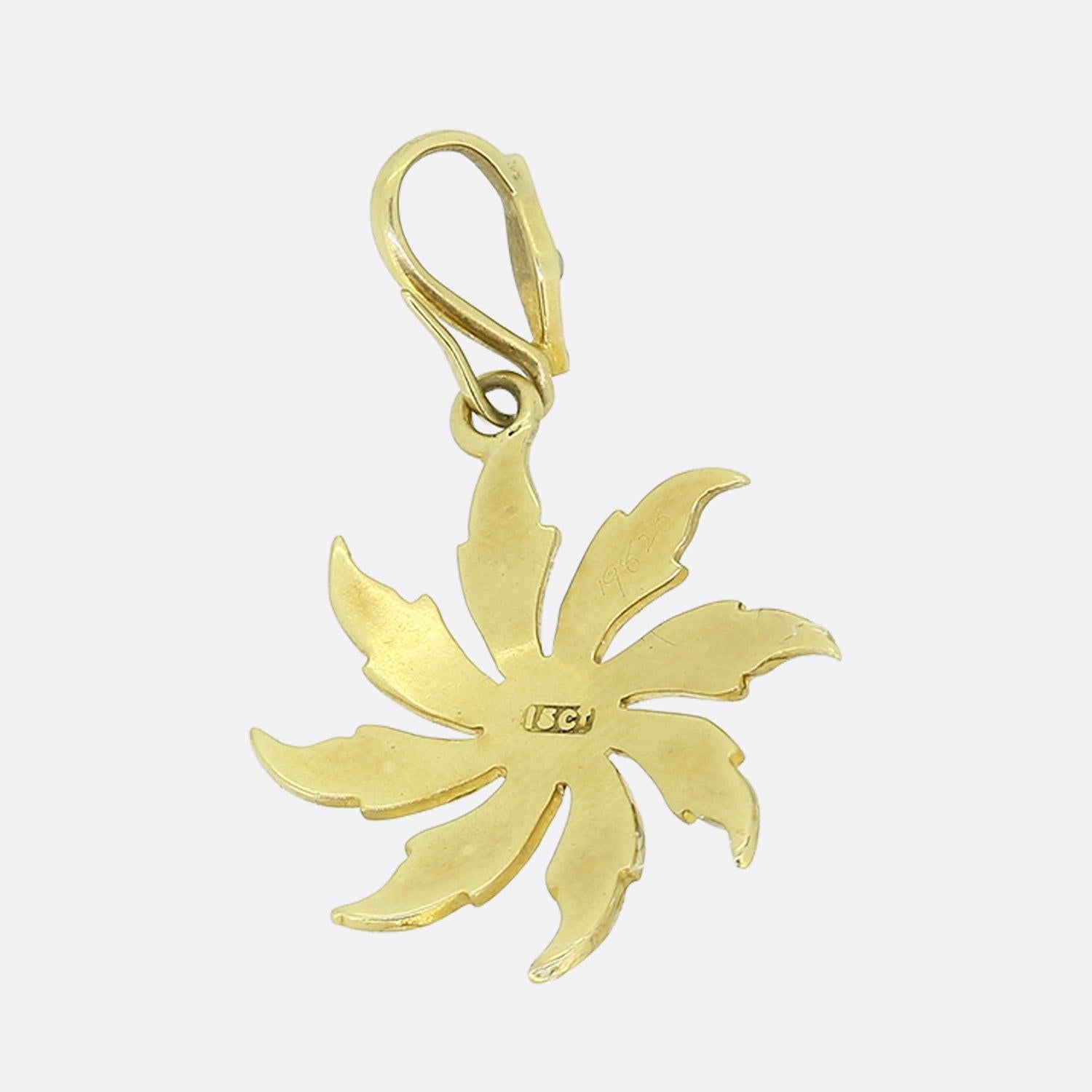 Here we have a splendid little pendant dating back to the Victorian era. This antique piece has been crafted from 18ct yellow gold into the shape of a sunflower flailing in the wind. Each of the eight petals have been set with a trio of rounded seed