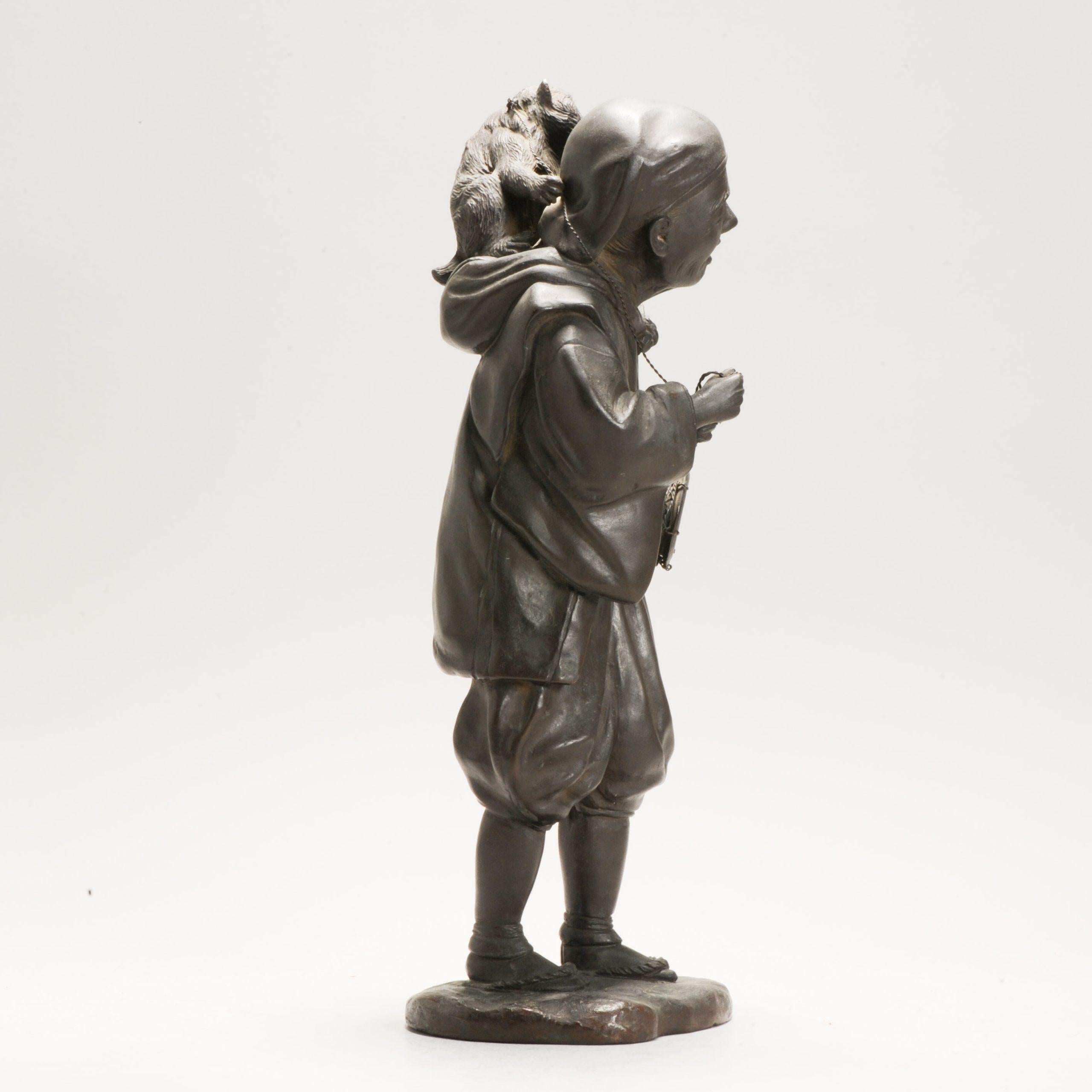 Japanese Antique Seiya-sei for Genryusai Seiya Bronze Man and Monkey Statue Japan Meij For Sale