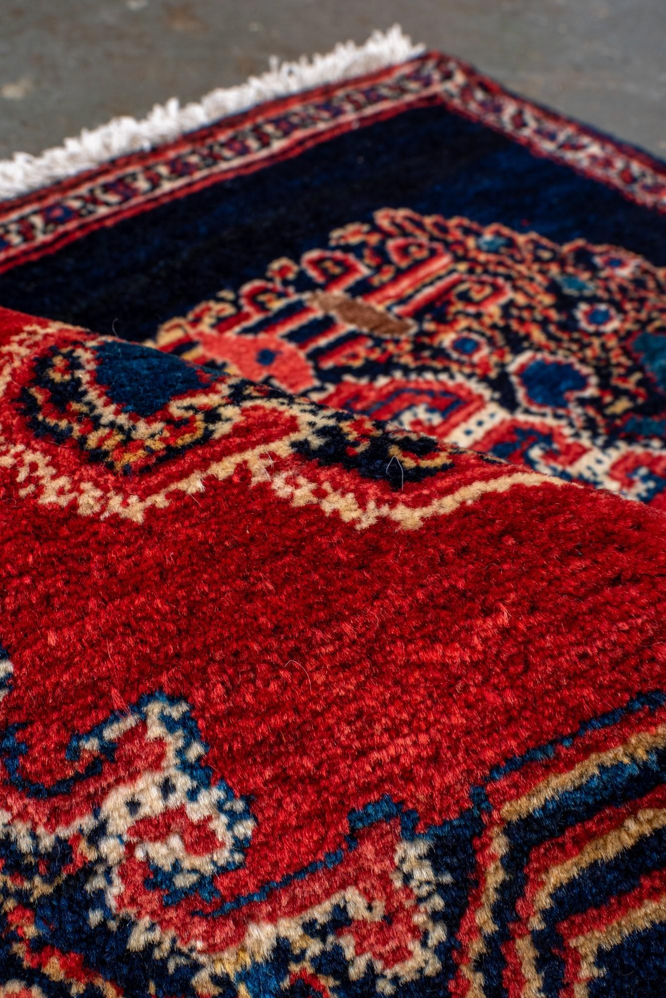 20th Century Antique Senneh Mat with Dark Blue Field and Red Medallion For Sale