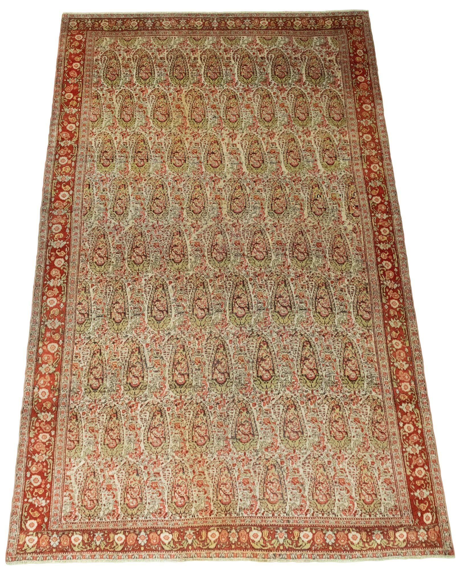 A wonderful antique Senneh rug, hand woven circa 1900 with an all over Boteh design on an ivory field and terracotta border. Very finely woven with wonderful secondary colours of greens and pinks and a very decorative rug.
Size: 2.02m x 1.36m (6ft