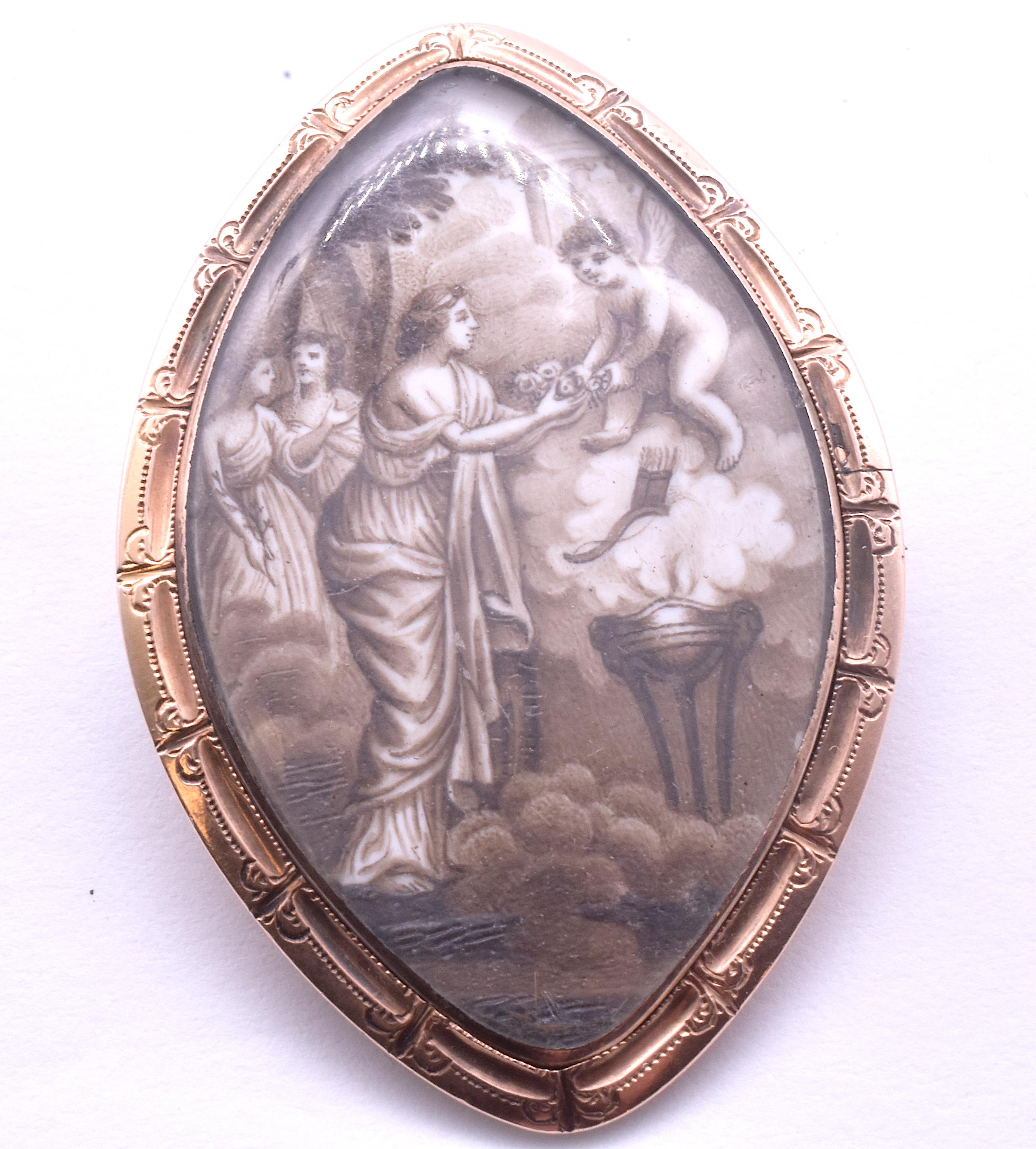 Amazingly detailed sepia painting of Cupid bestowing flowers on a young maiden. This navette shaped brooch, set in 15K gold, was a gift of love. On the reverse side can be seen two shades of hair intertwined, most likely the husband's and wife's,