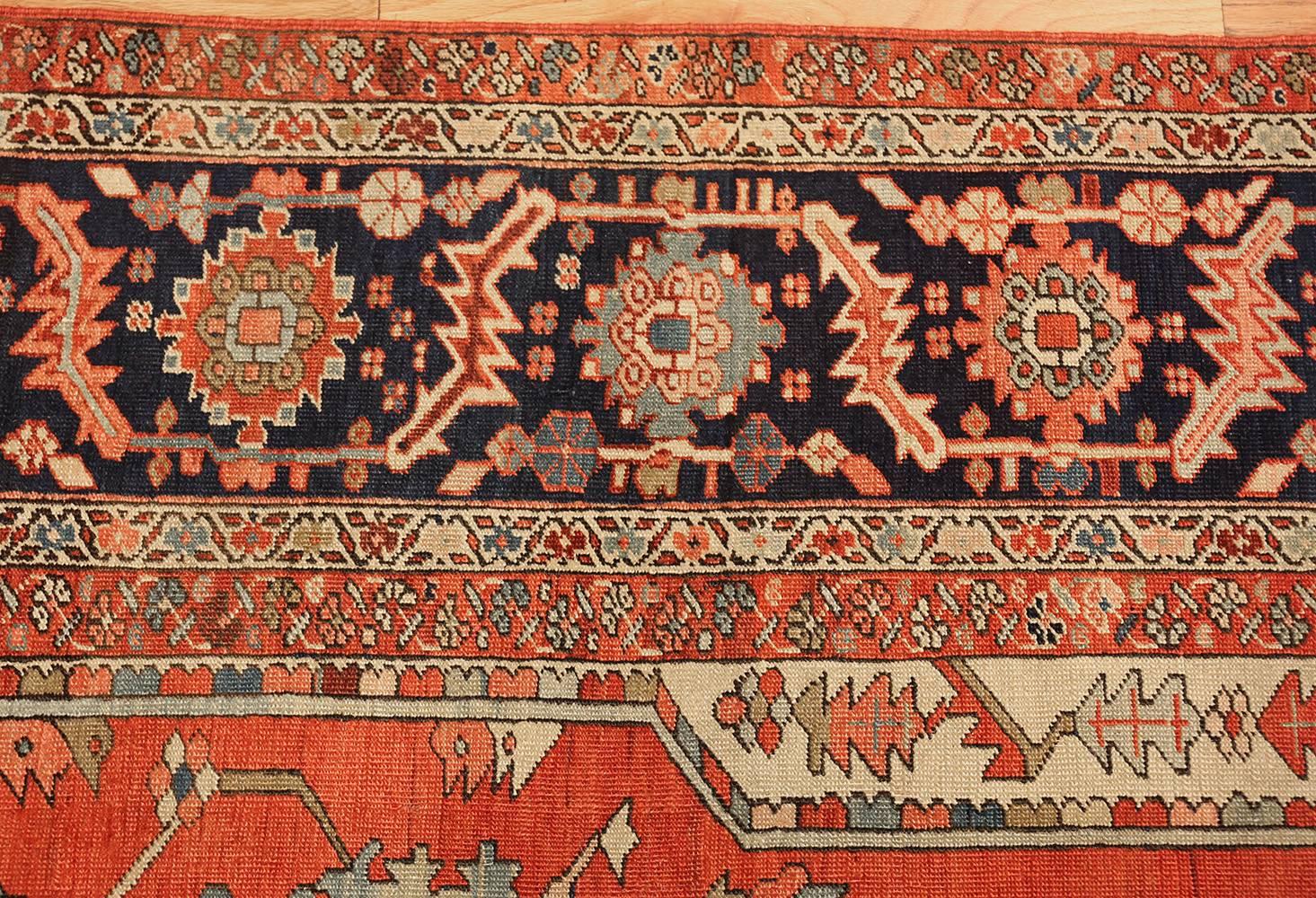 Beautiful Red Background Antique Serapi Persian Rug, Country of Origin / Rug Type: Persian Rug, Circa Date: 1900. Size: 10 ft 4 in x 13 ft 6 in (3.15 m x 4.11 m).