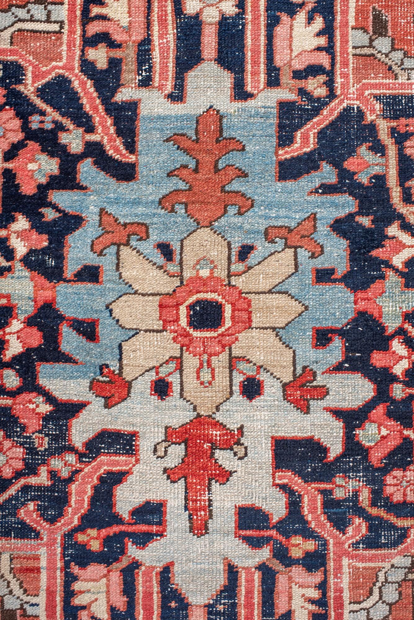 Hand-Knotted Antique Serapi Rug with Radiant Medallion and Cream Corners For Sale