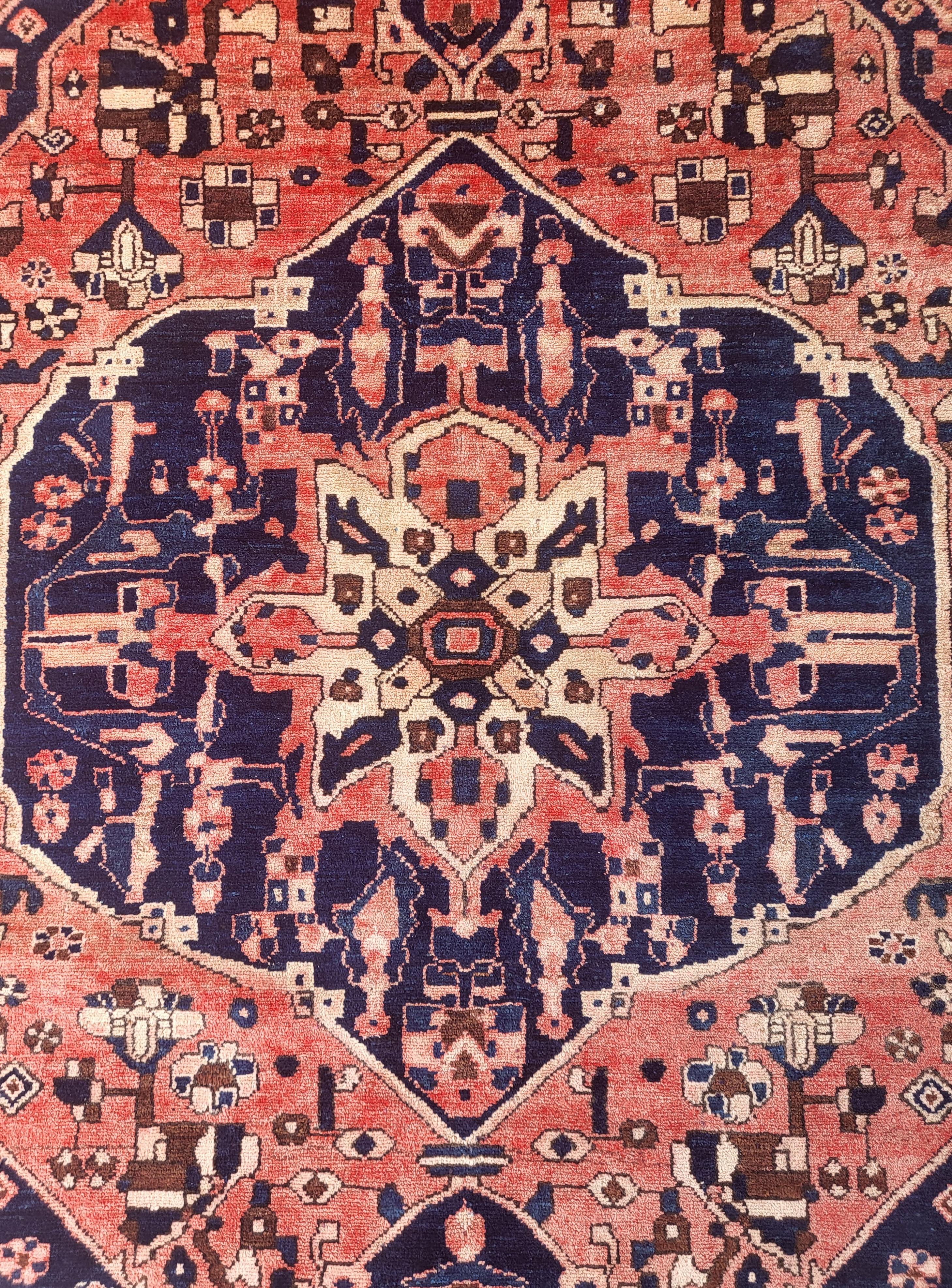 Delightful Antique Serapi style Bakhtiari 

7ft 4 x 5ft

Wonderfully aged Bakhtiari featuring a serapi design done in Bakhtiaris bold simplistic style. Woven near Heriz its easy to see how these weavers inspire off each other. 

Like Heriz rugs,