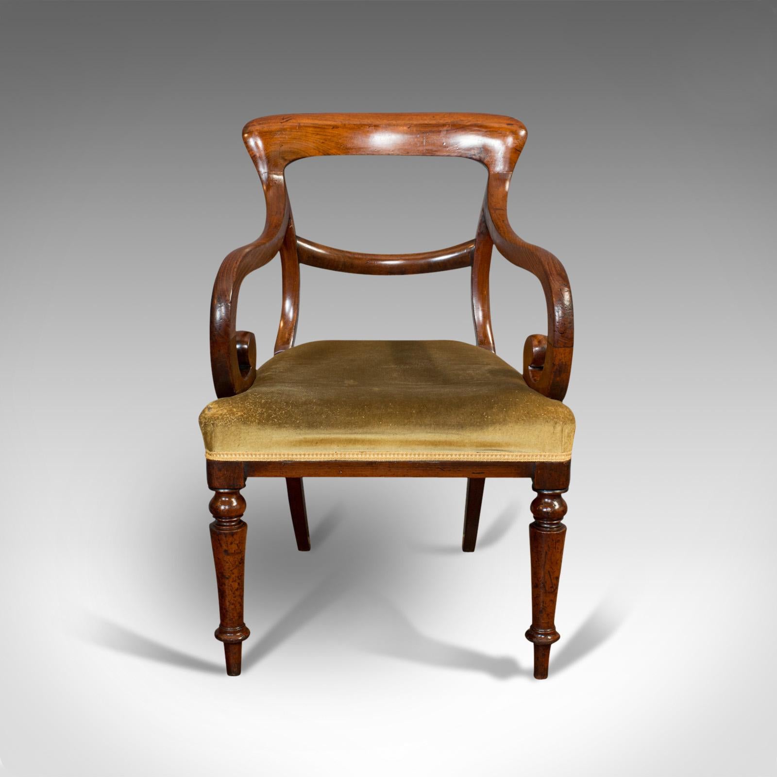 This is an antique serpentine armchair. An English, mahogany elbow seat, dating to the Regency period, circa 1820.

Attractive arm chair with alluring shape
Displays a desirable aged patina — some small marks to upholstery under closer