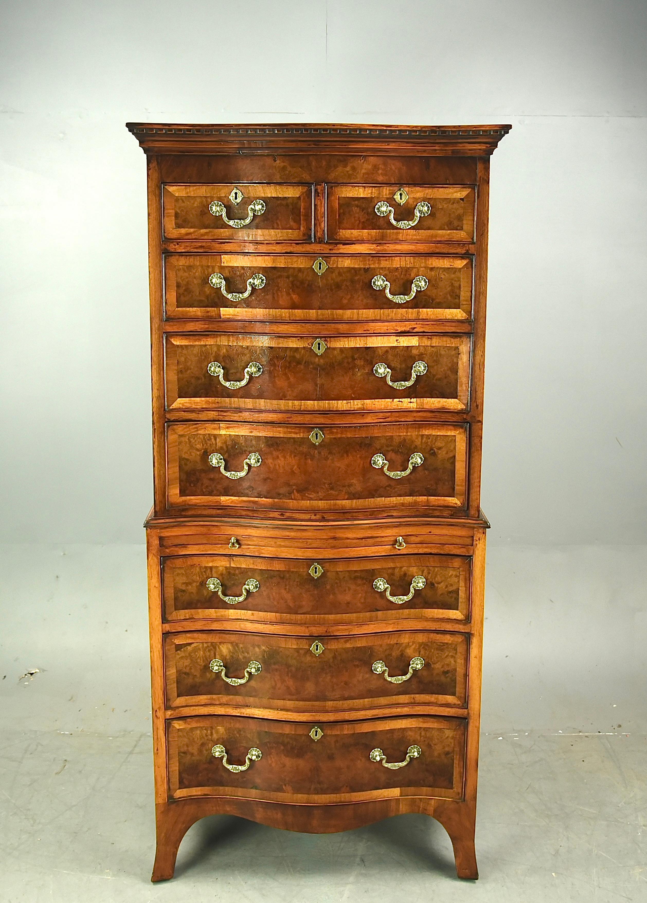 Fine Quality Burr walnut serpentine chest on chest with brushing slide circa 1900 .
Good quality serpentine chest that comes in two parts the top section having two short over three drawers ,the bottom section having a brushing slide over three