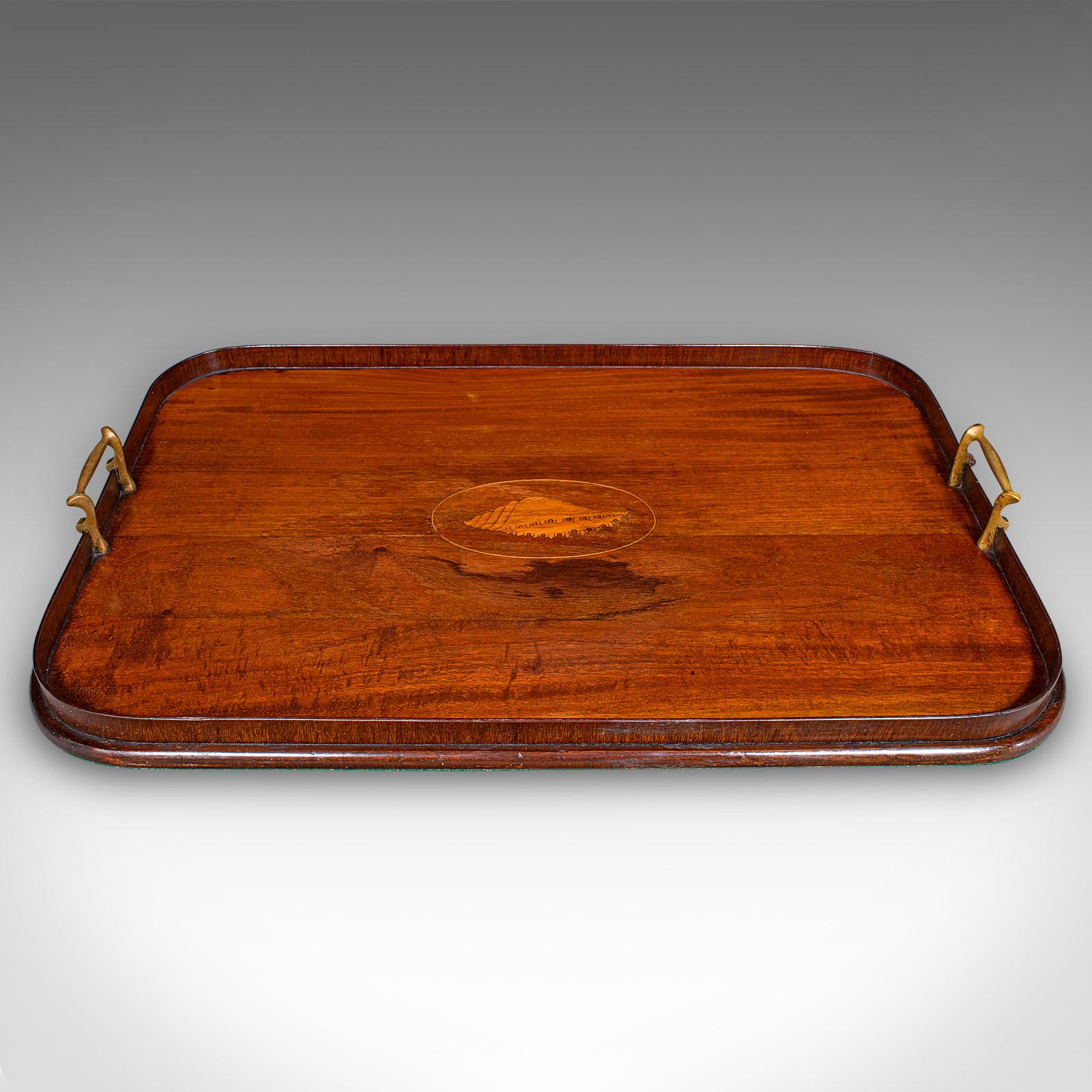 This is an antique serving platter. An English, mahogany afternoon tea tray crafted in Georgian revival taste, dating to the Edwardian period, circa 1910. A tactile and elegant tray, perfect for refined afternoon tea or evening cocktail