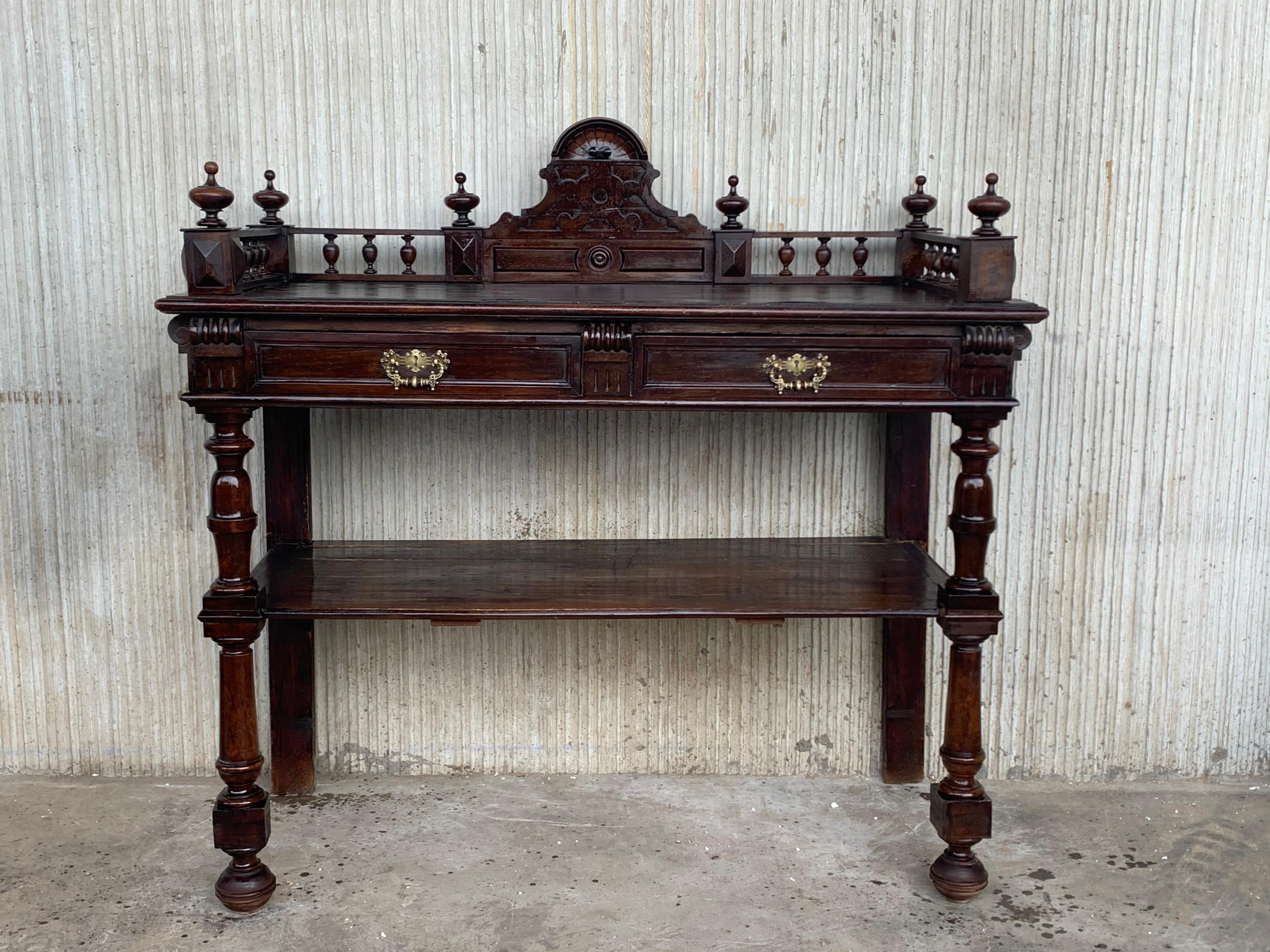 Antique serving table, Victorian carved walnut console table or hall table, antique furniture, France, 1890 .
Finish carved panel back with plate rail on top rectangular top with moulded edge Slant front with two drawers and original brass hardware