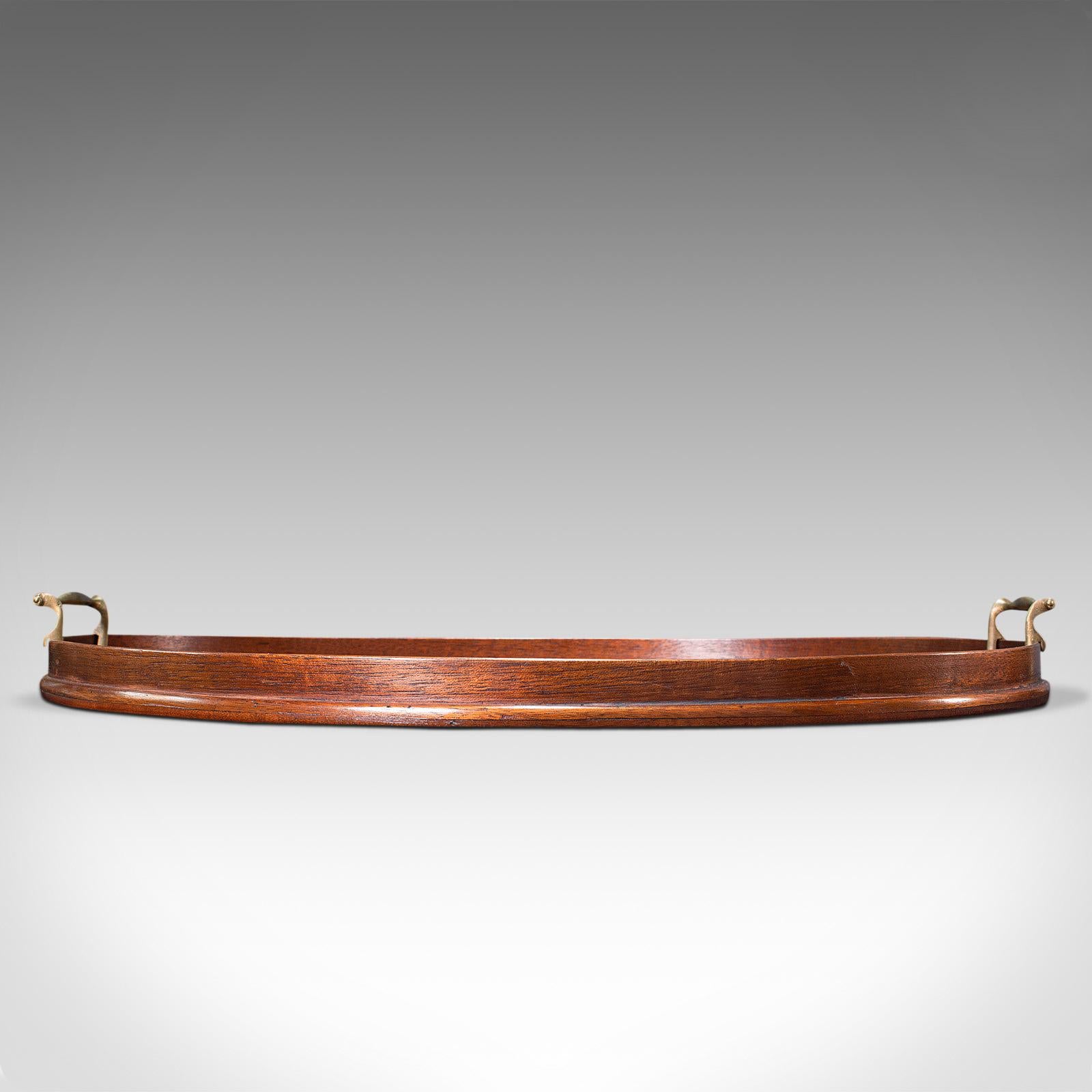This is an antique serving tray. An English, mahogany and brass butler's platter, dating to the Georgian period, circa 1800.

Serve your favourite drinks with this delightful antique tray
Displays a desirably aged patina - one small loss to
