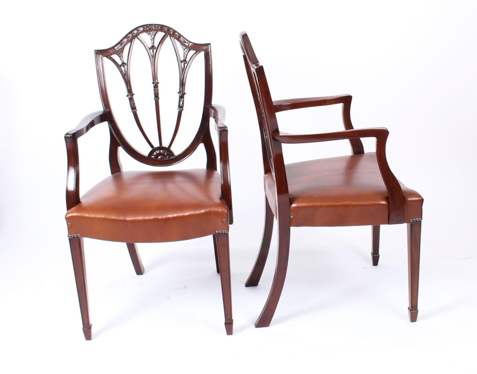 This is a fantastic antique English set of ten mahogany shield back dining chairs of 