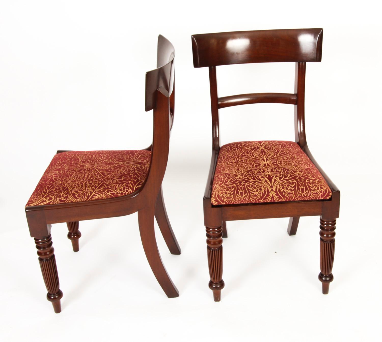 This is a fantastic antique English made set of ten William IV mahogany barback dining chairs, circa 1830 in date.
 
The set comprising eight singles and two armchairs, with plain crest rails and splats the drop in seats upholstered in wine and