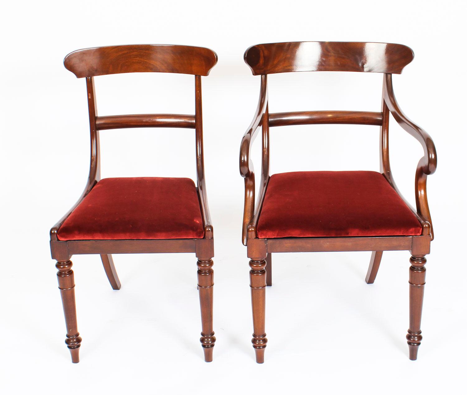 This is a fabulous set of twelve antique English Victorian bar back dining chairs, circa 1860 in date.

The set comprises ten sidechairs and a pair of armchairs, and they have all been masterfully crafted in beautiful solid flame mahogany. They
