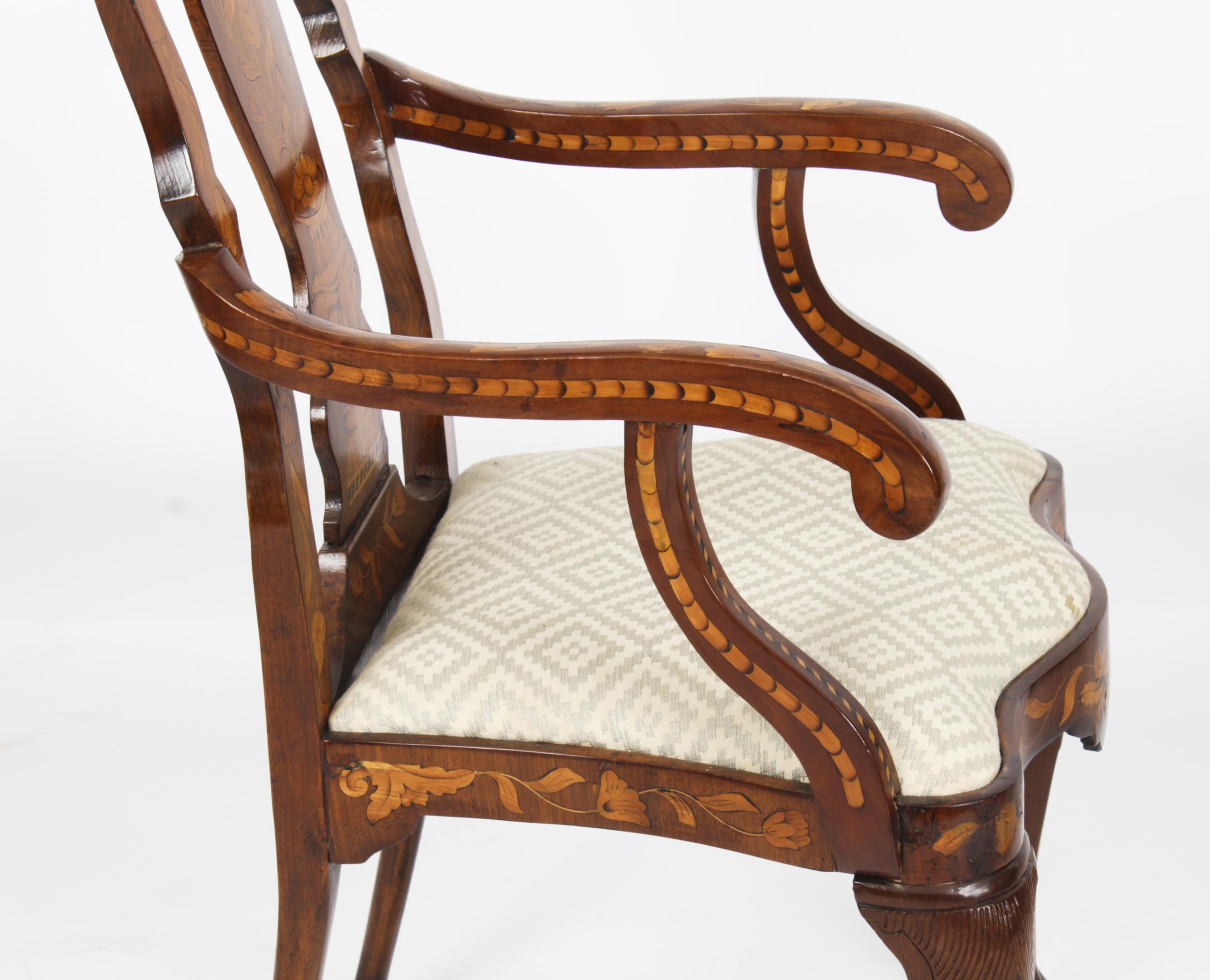 This is a wonderful and rare antique harlequin set of twelve high backed Dutch walnut and floral marquetry dining chairs, Circa 1780 in date.
 
The set comprised ten side chairs and two armchairs that have been skillfully crafted from walnut and