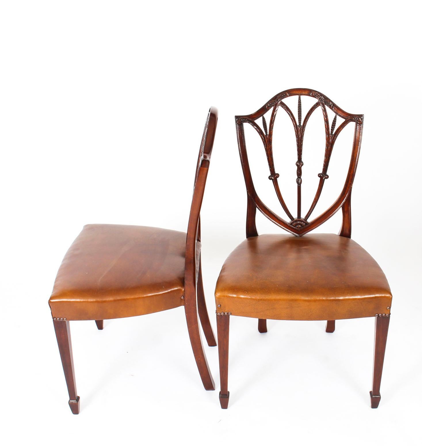 This is a fantastic antique English set of twelve mahogany shield back dining chairs of 