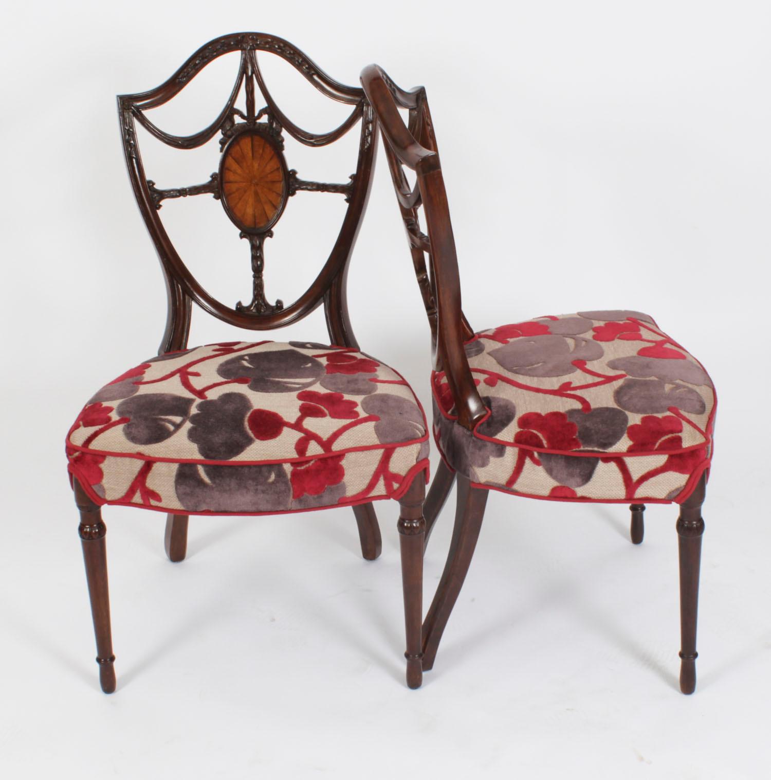 This is a fantastic antique English made set of twelve mahogany shield back dining chairs of 