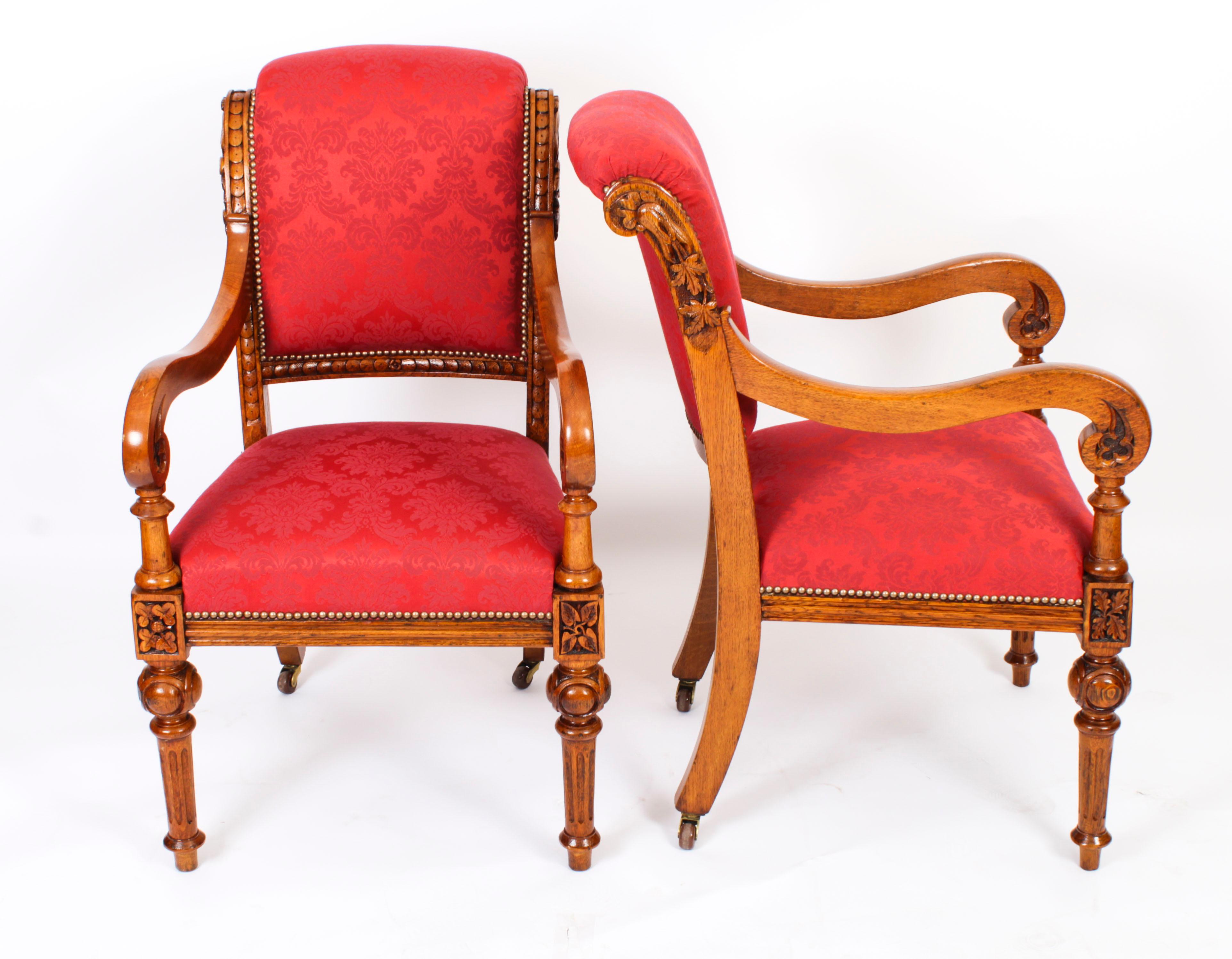 A superb and rare long set of fourteen antique Irish oak dining arm-chairs, Circa 1840 in date.
  
The carved  oak frames are decorated with three and four leaf clovers, foliage and oak leaves, the shoulders with overlapping discs.
  
Each armchair
