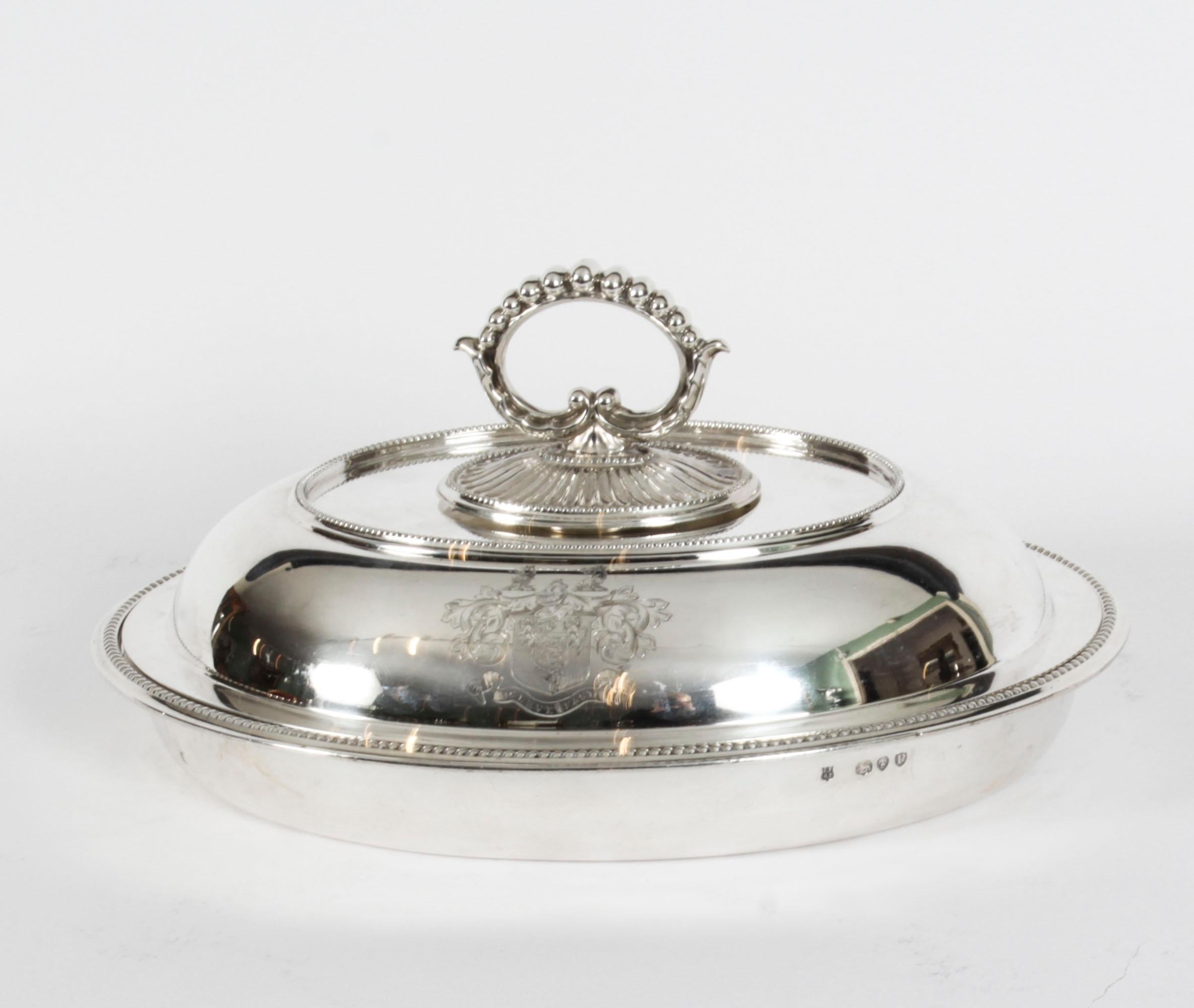 This is a wonderful set of four English antique sterling silver entree dishes and covers with hallmarks for Finley & Taylor, Birmingham and dated 1890 with a weight of 207 ozs.
 
The shaped oval dishes are applied with gadrooned rims and anthemion