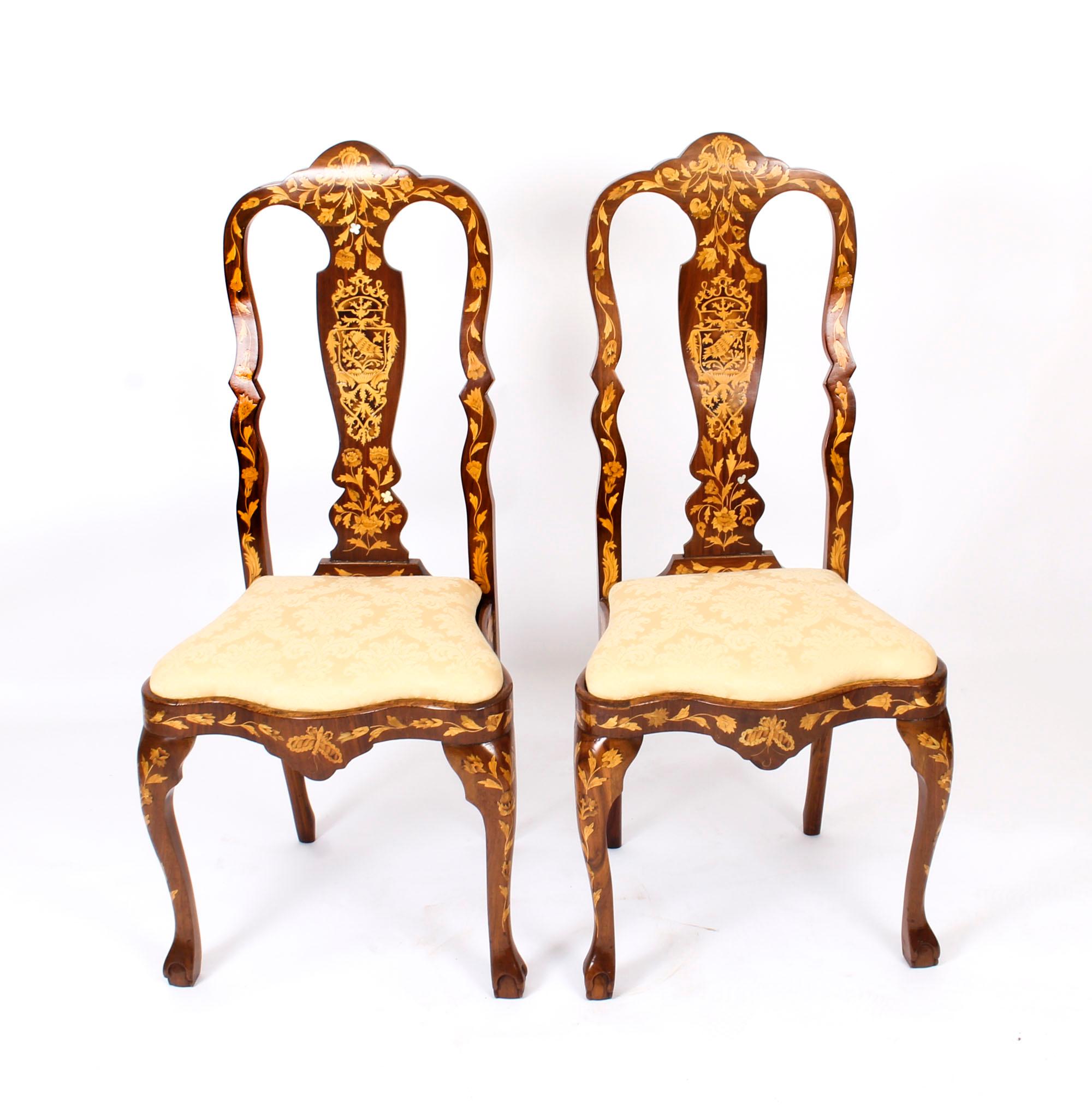 This is a wonderful and rare antique set of six high backed Dutch walnut and floral marquetry dining chairs, circa 1780 in date.

The chairs have been skillfully crafted from walnut, bear profuse floral marquetry inlaid decoration and are typical