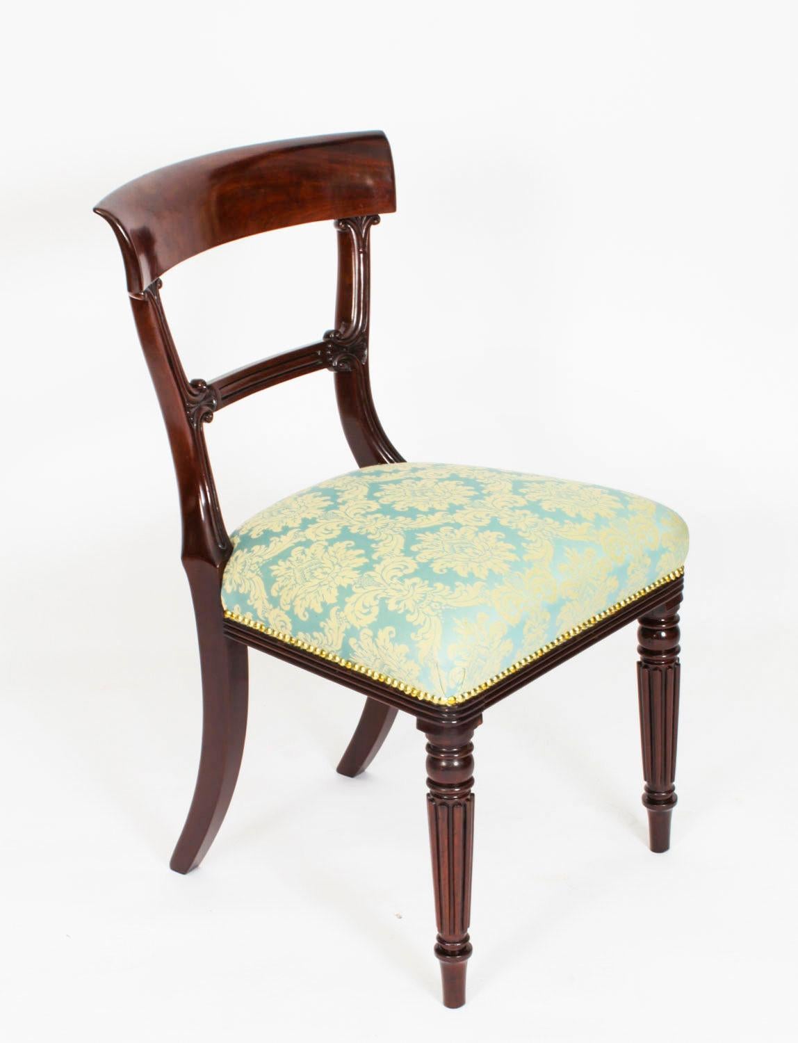 This is a fantastic English set of eight antique  William IV barback dining chairs, circa 1830 in date.

The set comprising eight sidechairs with seats that have been reupholstered in a striking azur fabric, and  raised on  reeded baluster front