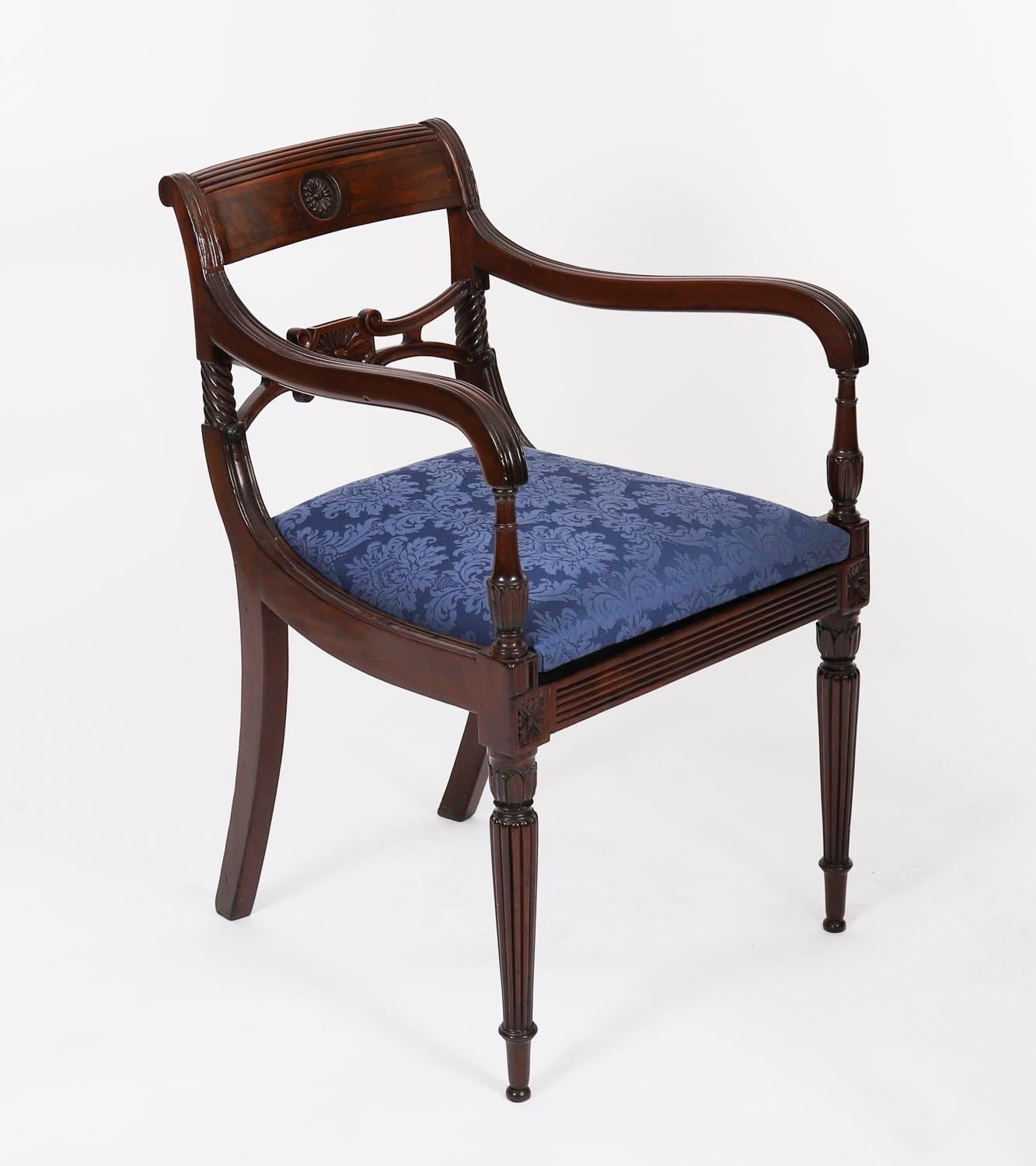 A fabulous set of eight Regency Period, George III mahogany dining chairs, Circa 1820 in date.

The set comprising six side chairs and a pair of open armchairs all with ribbed solid top rails centred by florets, pierced scrolling splats with floral