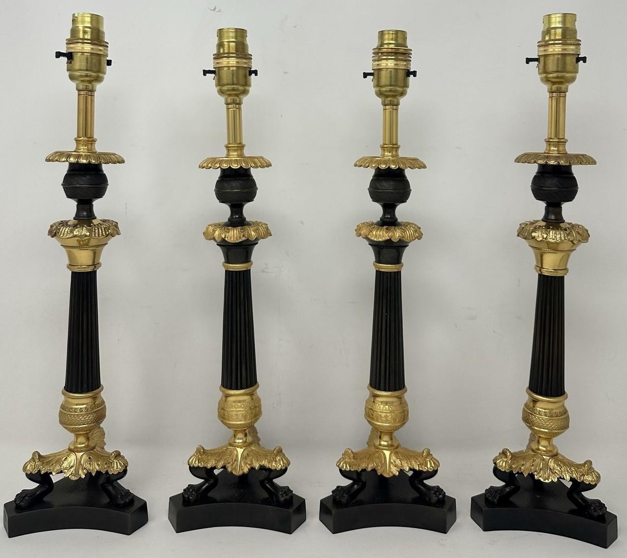 An Exceptionally Fine and quite rare Set of Four (two identical pairs) French Ormolu and patinated Bronze early Victorian Single Light Candlesticks of tall slender form and fairly standard lamp proportions, now converted to a Stunning set of four