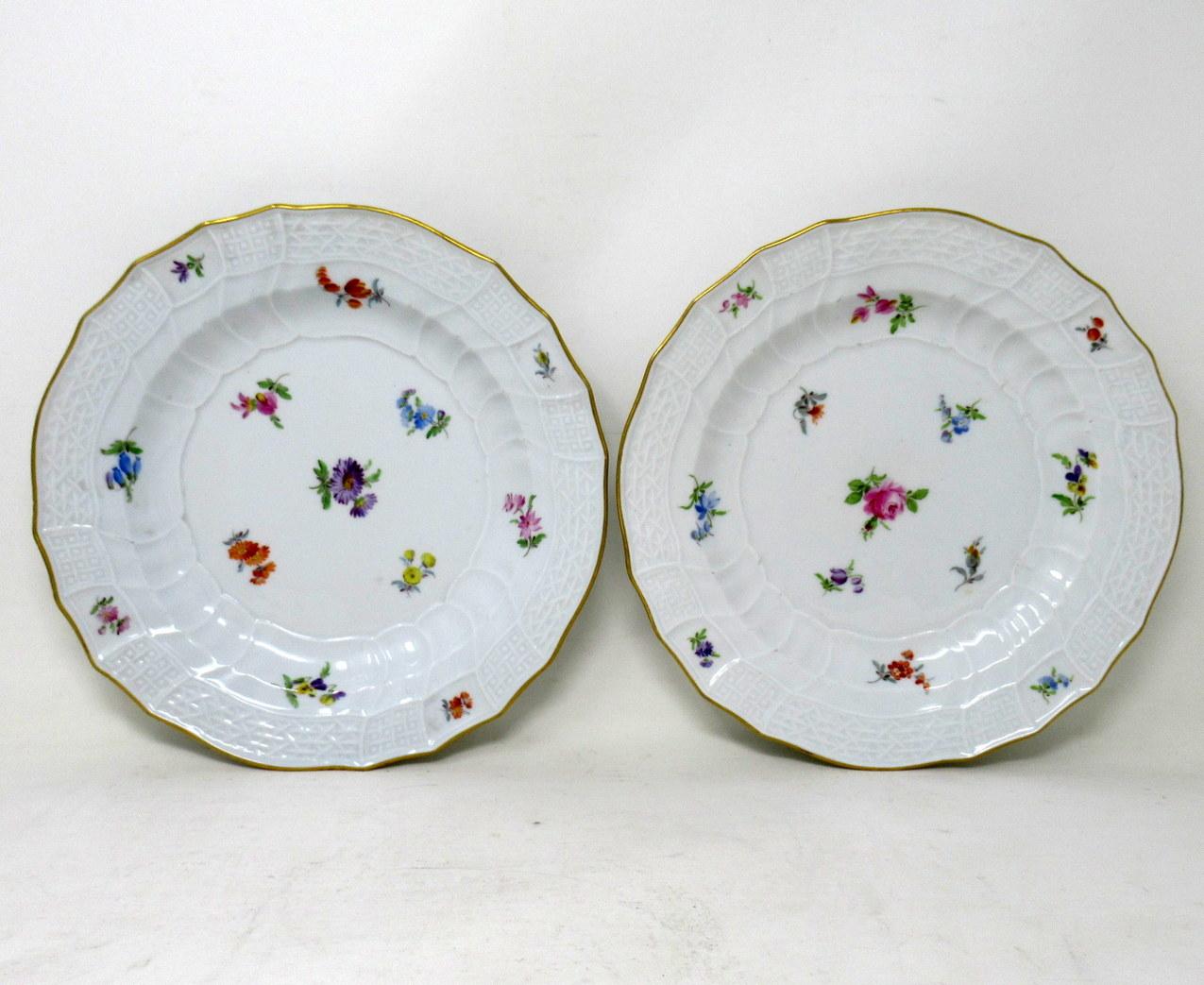 An exceptionally rare set of two German Meissen Floral Themed Porcelain Cabinet Plates of circular outline, last quarter of the Nineteenth Century. 

Each central reserve exquisitely hand painted scattered views of decorative still life of Summer