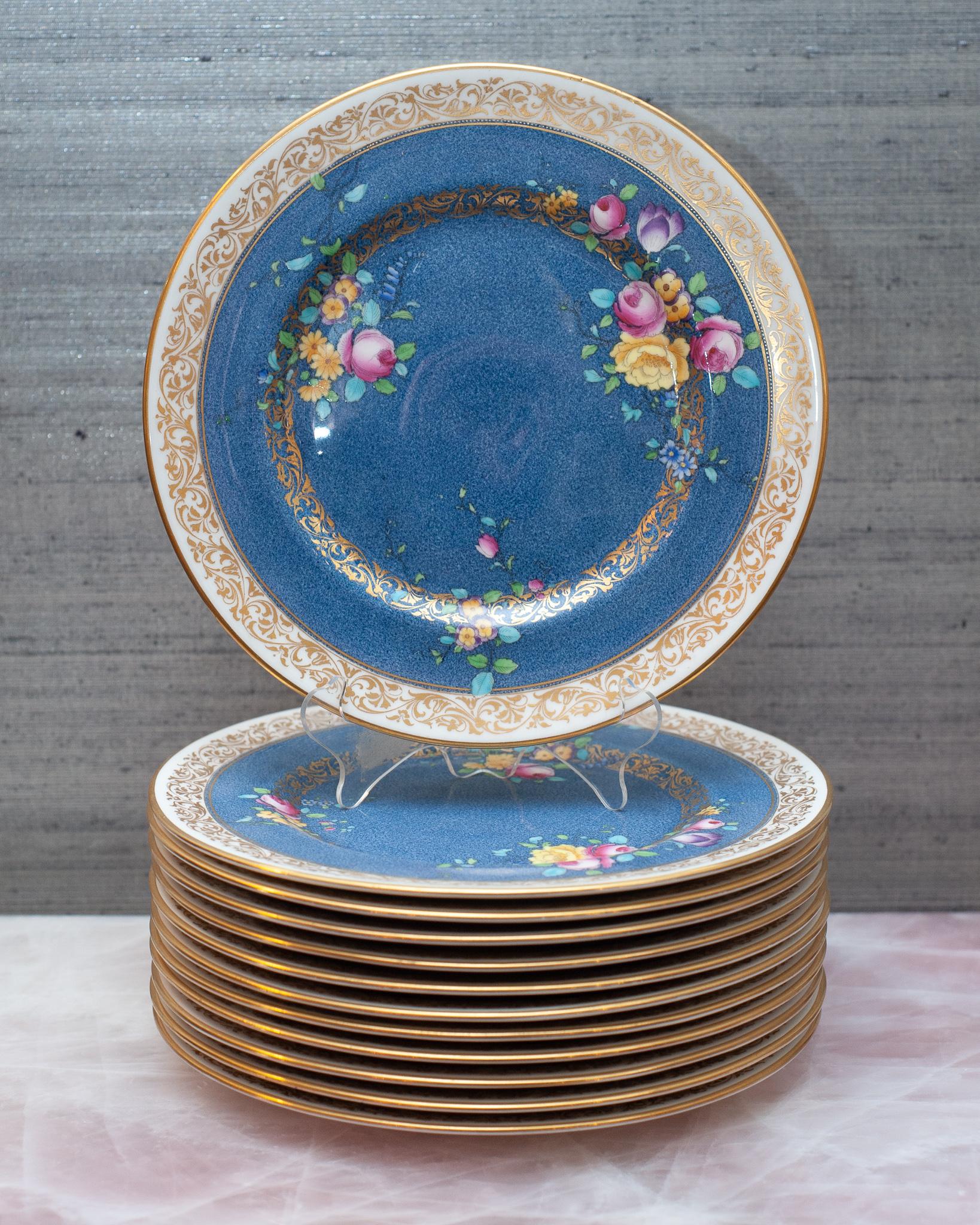 A beautiful set of 12 antqiue floral and gilt dishes, manufactured by Royal Doulton for J.E. Caldwell.