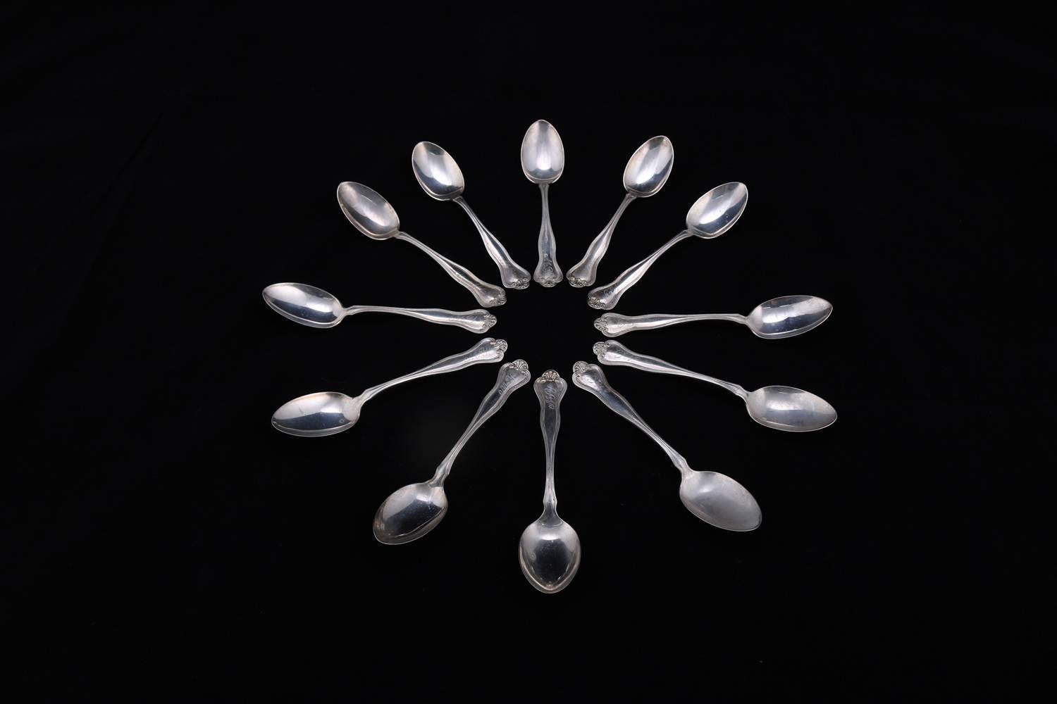 Set of 12 antique sterling silver teaspoons features shaped handles with scroll and stylized shell design and having monograms, en verso marked, 9.77 toz, circa 1900

***DELIVERY NOTICE – Due to COVID-19 we are employing NO-CONTACT PRACTICES in the