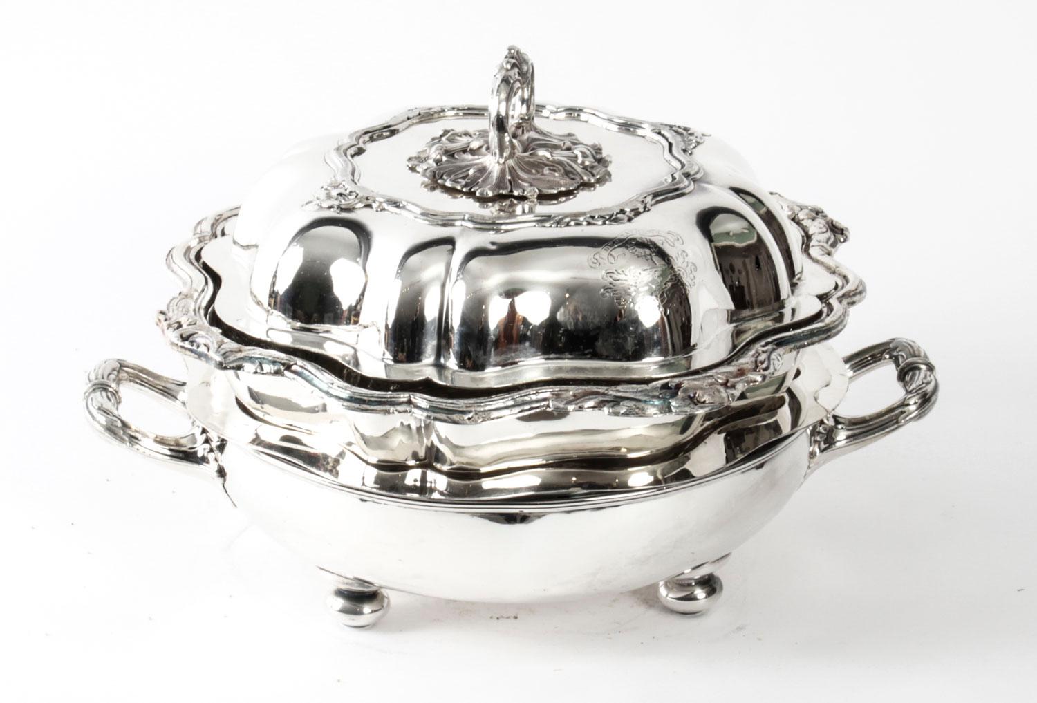 This is an exquisitely high-quality and rare antique set of four English Old Sheffield plate, (silver plate on copper) serving dishes with stands and covers, Circa 1815 in date. 

These stunning shaped circular entree dishes each with circular