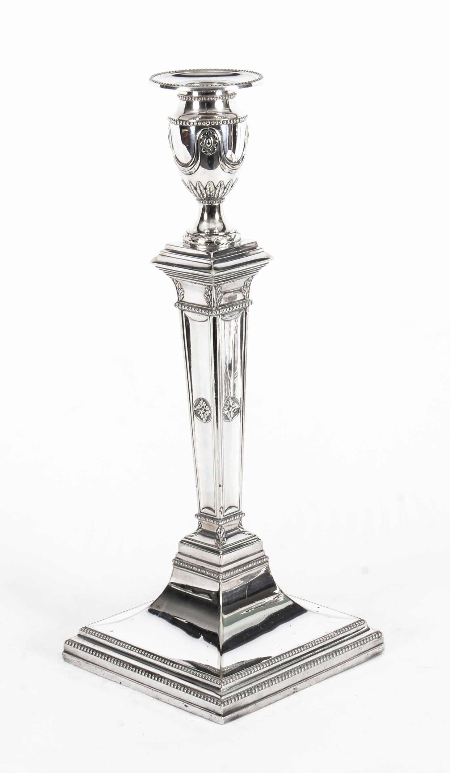 This is a magnificent and rare set of four antique English Victorian silver plated candlesticks bearing the figural makers mark of James Dixon & Sons, Sheffield, circa 1875 in date.

Each of these stunning classically style candlesticks features