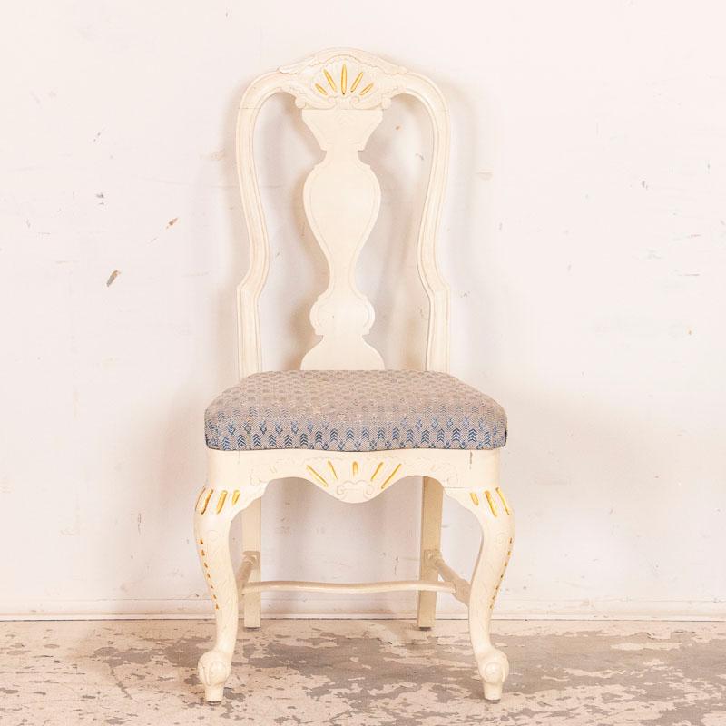 Class and style combine in this lovely set of six matching dining chairs from Sweden. They were painted white and given a gold trim which was the 