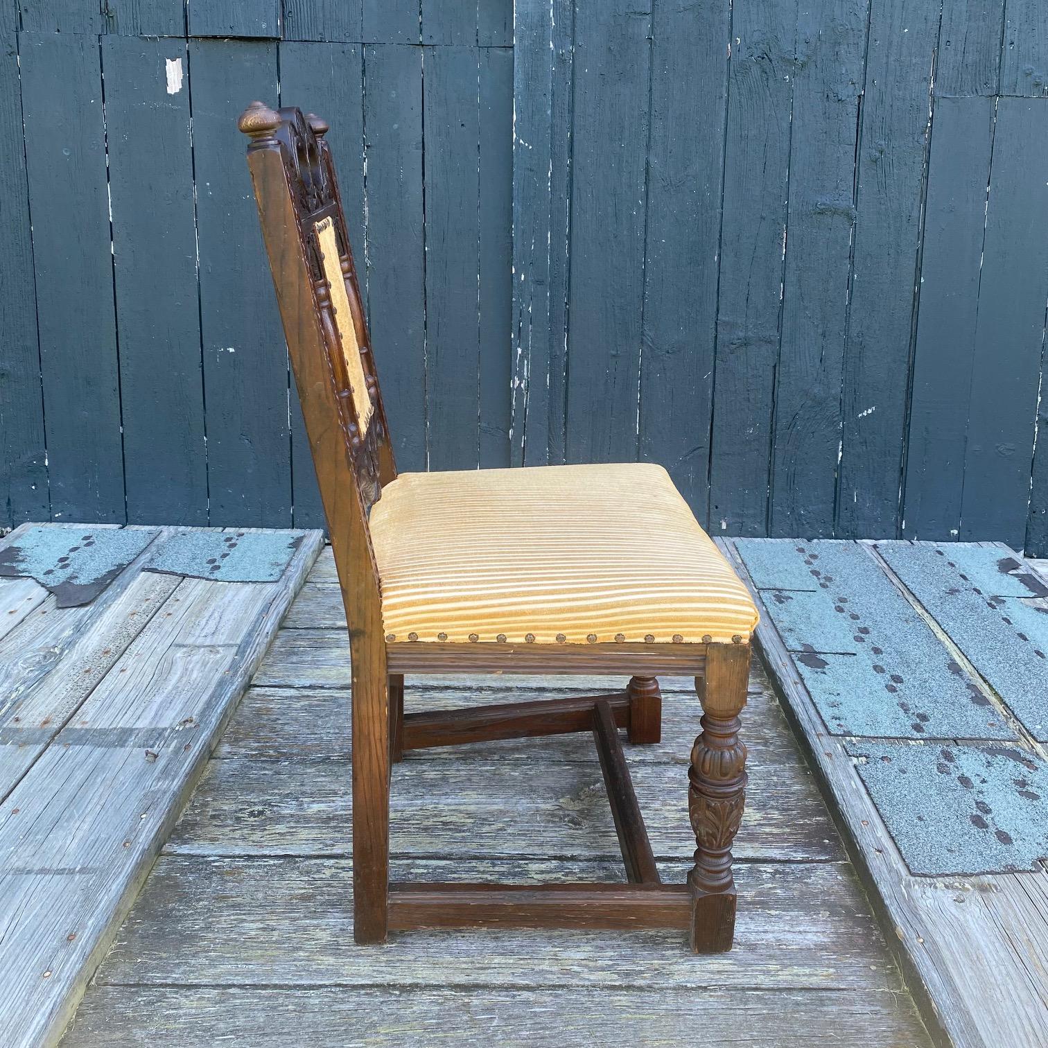 Early 20th Century Antique Set of 8 British Jacobean Style Carved Oak Dining Chairs