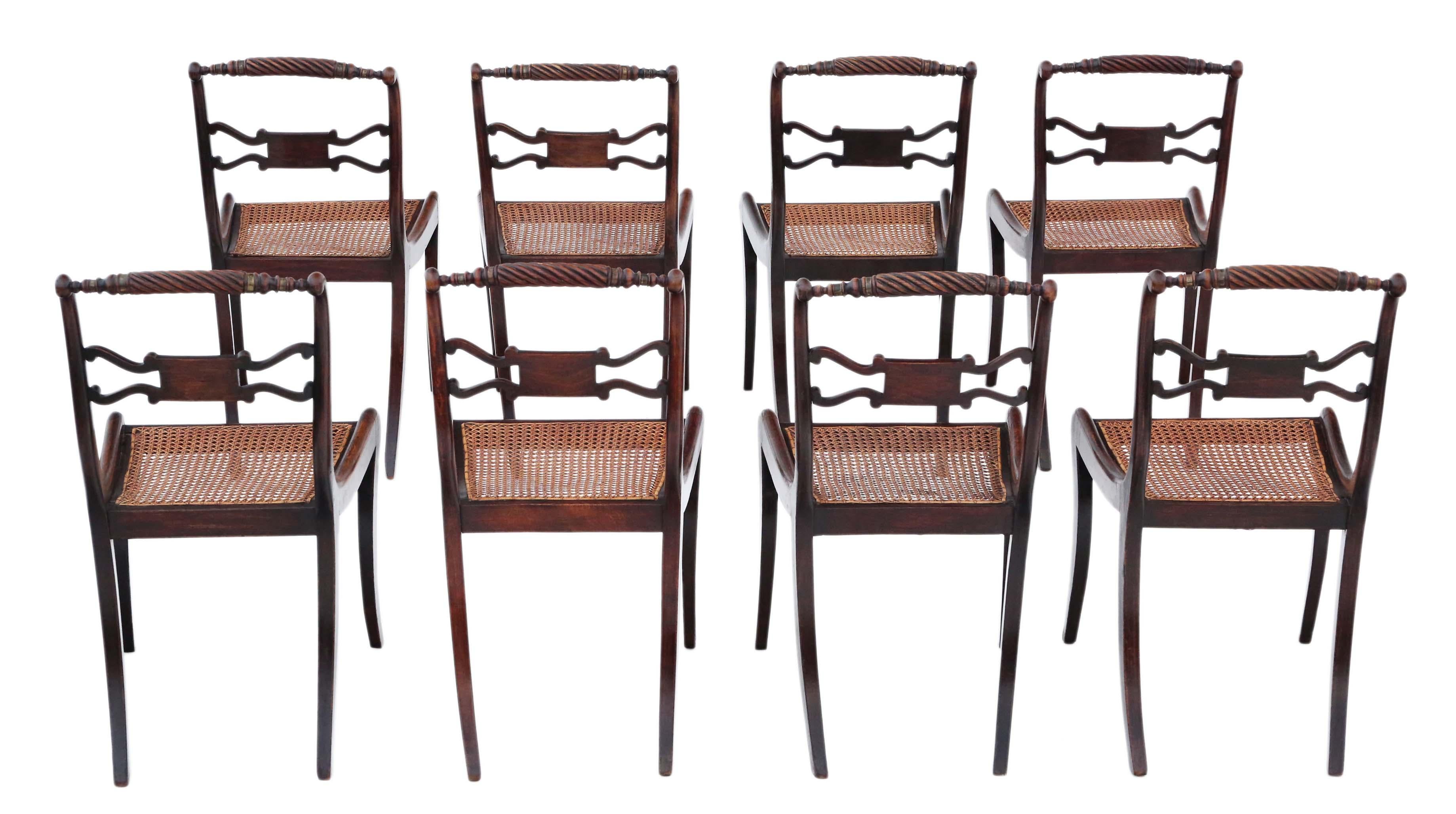 Antique fine quality set of 8 Regency circa 1825 faux rosewood dining chairs, 19th century. The very best color and patina with desirable sabre front legs. Very rare!

Solid with no loose joints. Lovely elegant design with brass work. No
