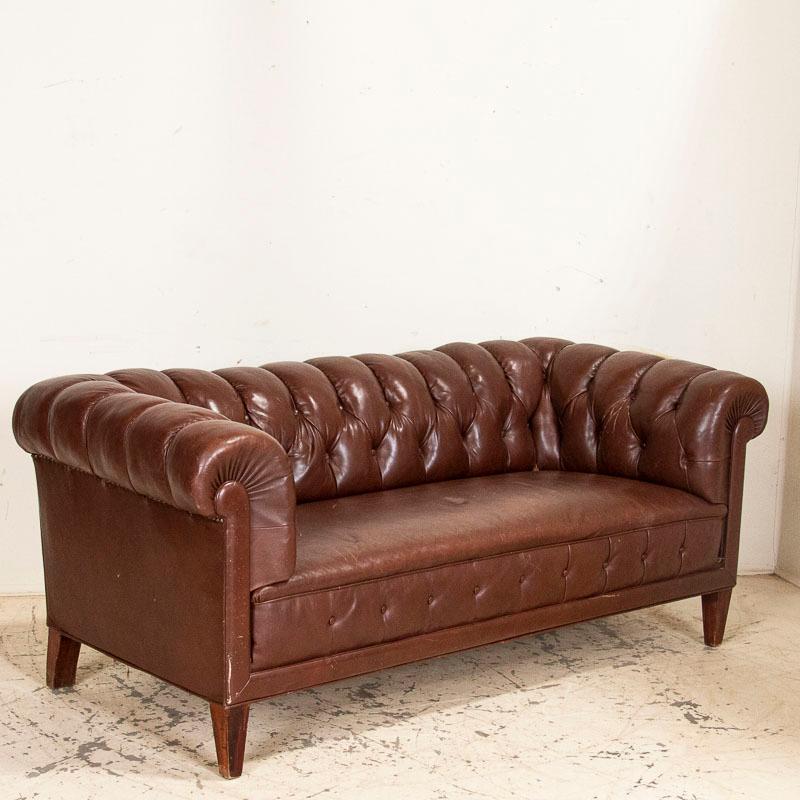 It's not often we find a complete set of vintage Chesterfield sofa and club chairs, so this set is a fun find. Please note this set is all original, so the brown leather does show wear, nicks, some impressions, etc. which is common and expected in