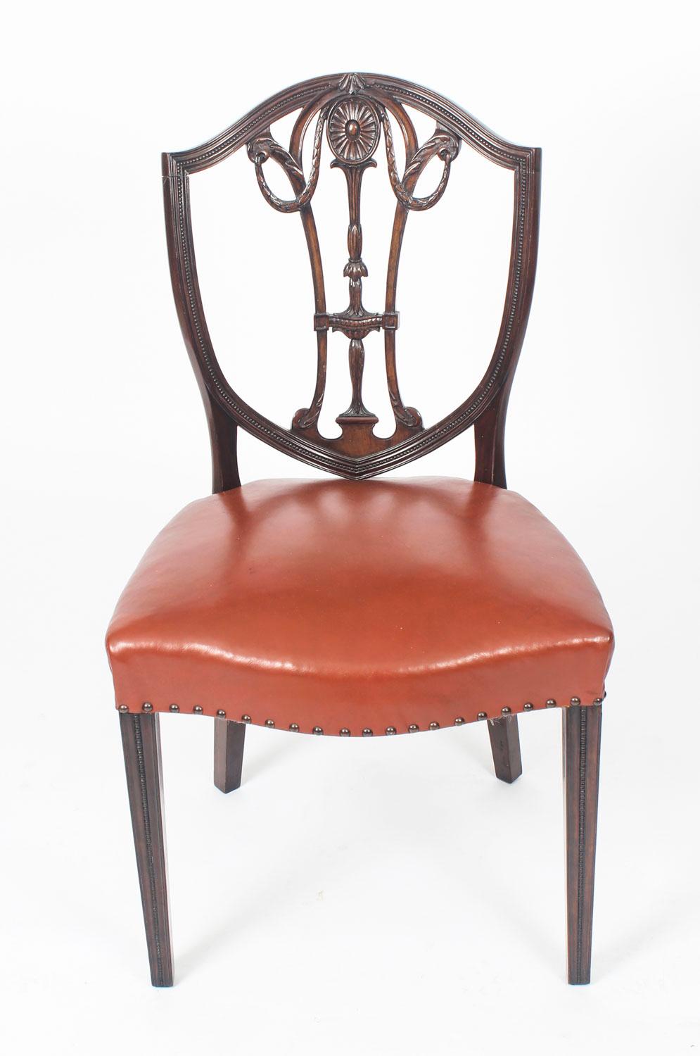 This is a fantastic antique English set of eight mahogany shield back dining chairs of 