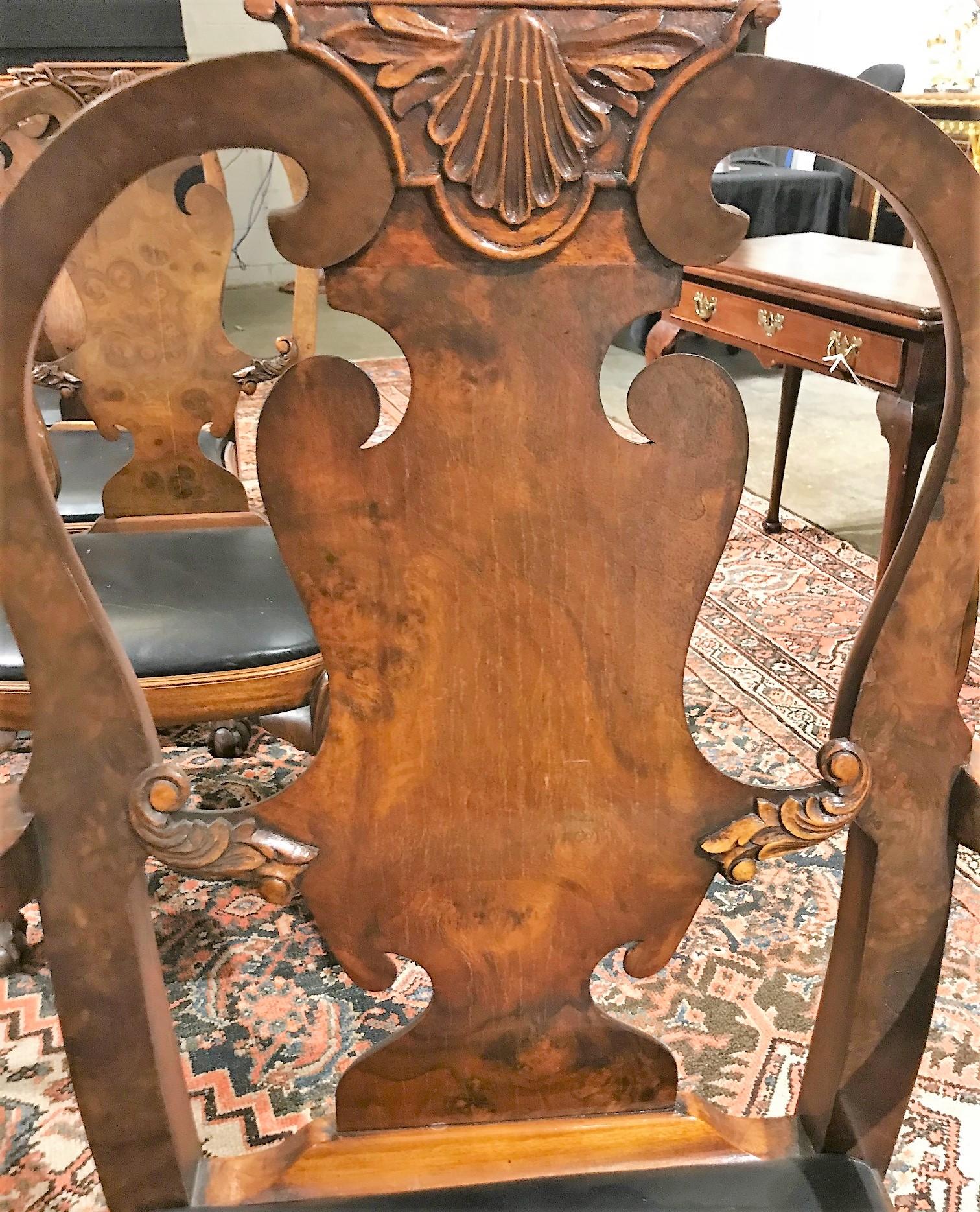 Superb set of antique English Queen Anne style walnut dining chairs comprising six side chairs and two shepherd's crook armchairs. Each with carved leaf and shell crests, spoon backs, shaped splats, and balloon slip seats. The front legs of cabriole