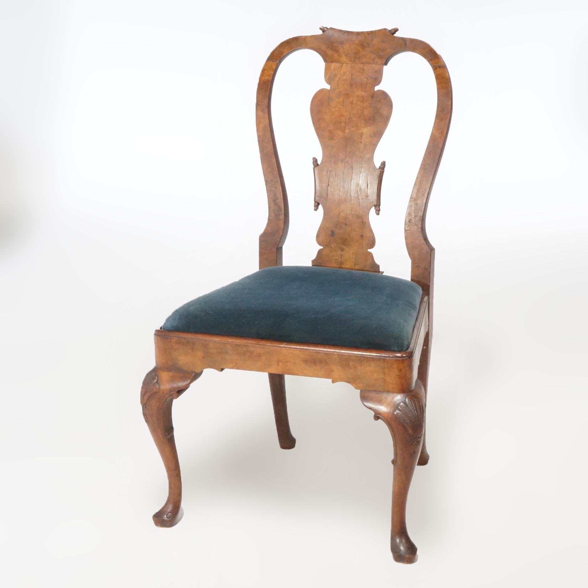 An antique set of eight Queen Anne dining room chairs offers walnut construction with urn form slat backs over upholstered seats, raised on cabriole legs with pad feet, c1920

Measure - 39.5