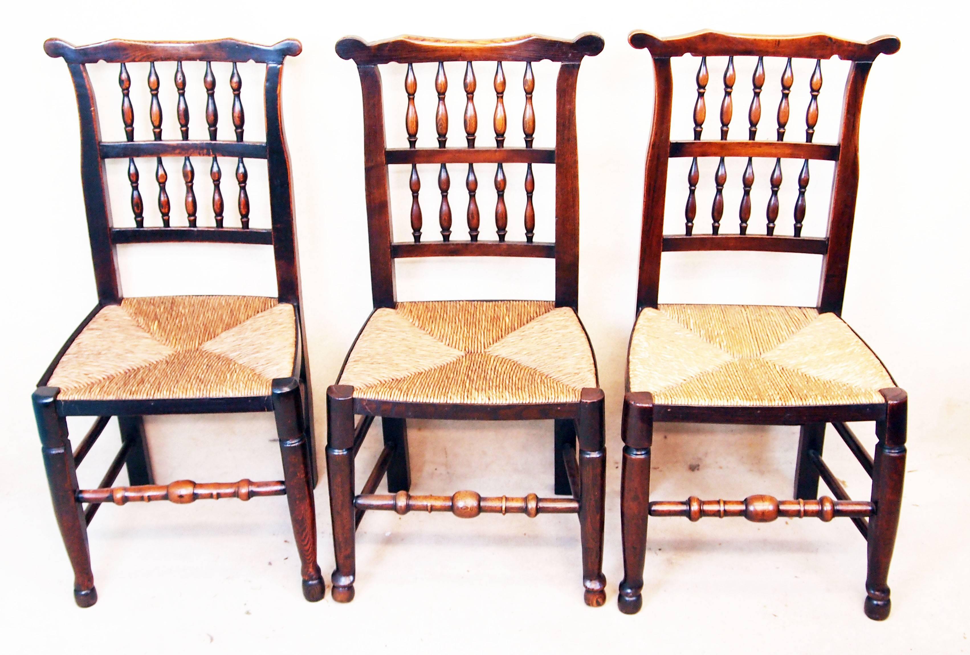 A very attractive matched set of eight (six single and two arm) early 19th
century ash and elm spindle back dining chairs having rush
seats in good order raised on elegant turned legs and
stretchers,

circa 1800.

Measures: Height 37in
