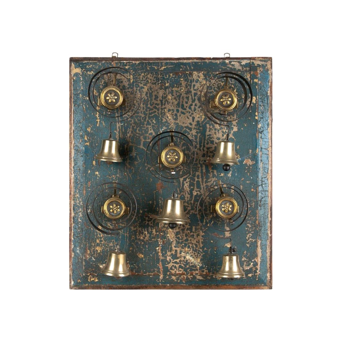 Antique Set of Five Brass House Bells Mounted on Blue Paint Wood Panel