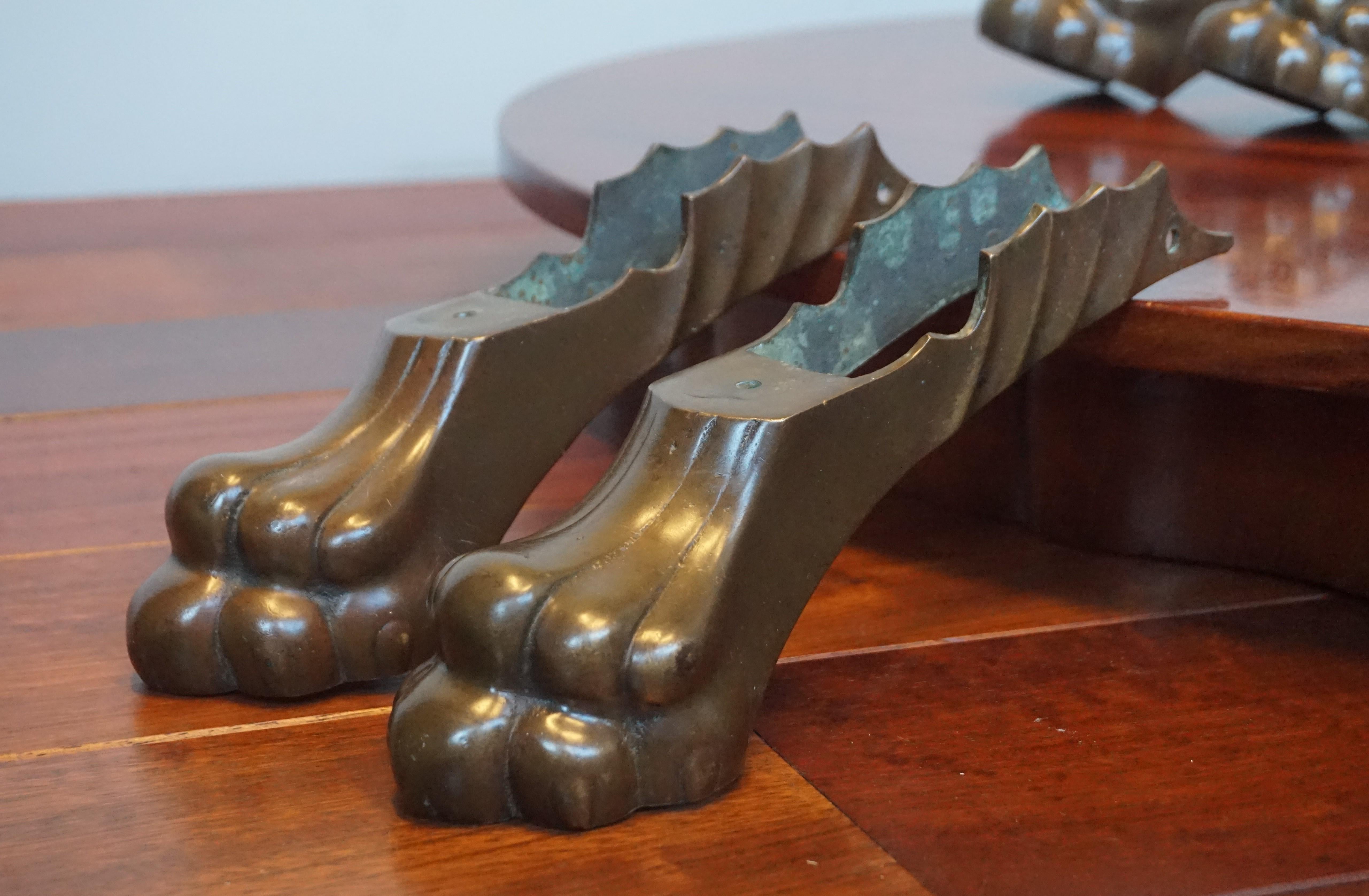 Stunning set of four 19th century, large bronze claw feet from a table or otherwise.

This large and impressive set of four top quality crafted bronze claw feet must have been under an amazing table or under a kingsize sideboard. Due to all kinds