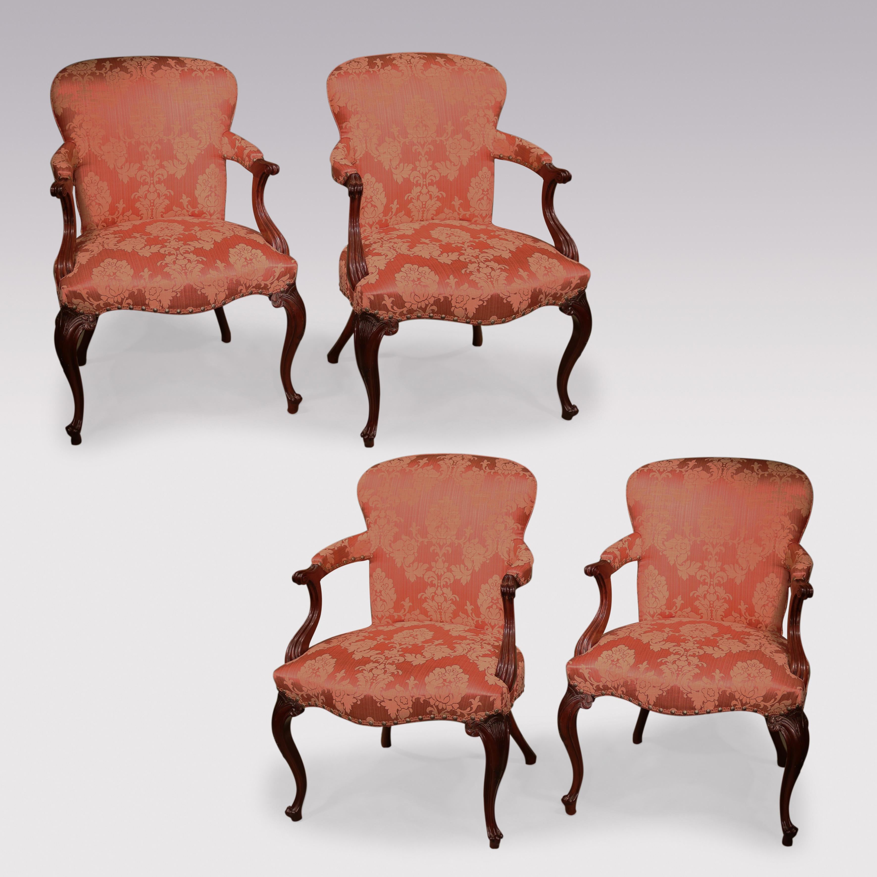 A fine set of 4 late 18th Century Hepplewhite period mahogany upholstered Armchairs in the French manner, having shaped backs & setback scroll-end moulded arms.  The chairs with serpentine shaped stuffover seats, supported on carved cabriole legs