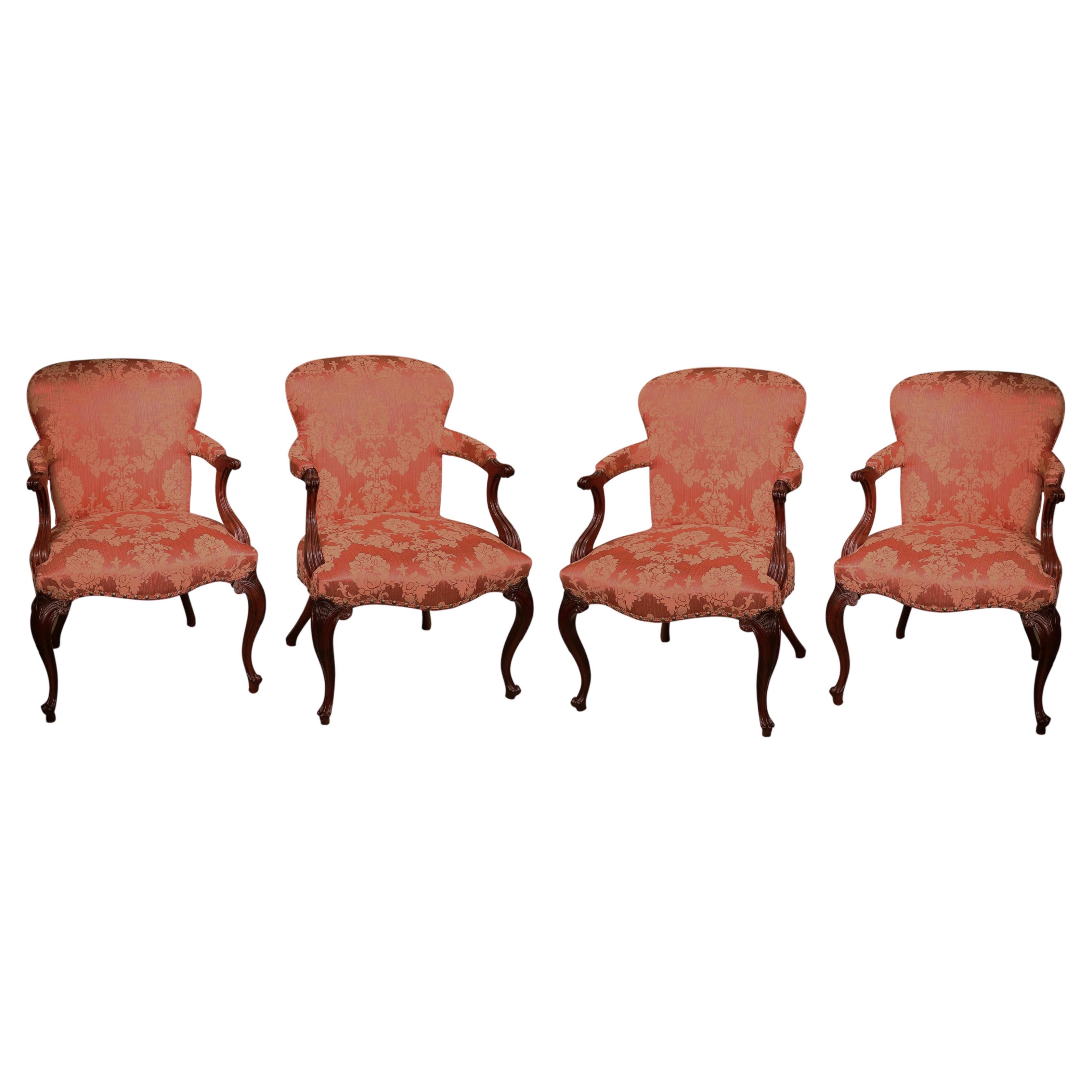Antique set of four Hepplewhite period carved mahogany stuffed back armchairs