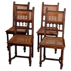 Antique Set of Four Italian Carved Walnut and Caned Dining Chairs, circa 1900