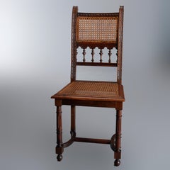 Antique Set of Four Italian Carved Walnut and Caned Dining Chairs, circa 1900