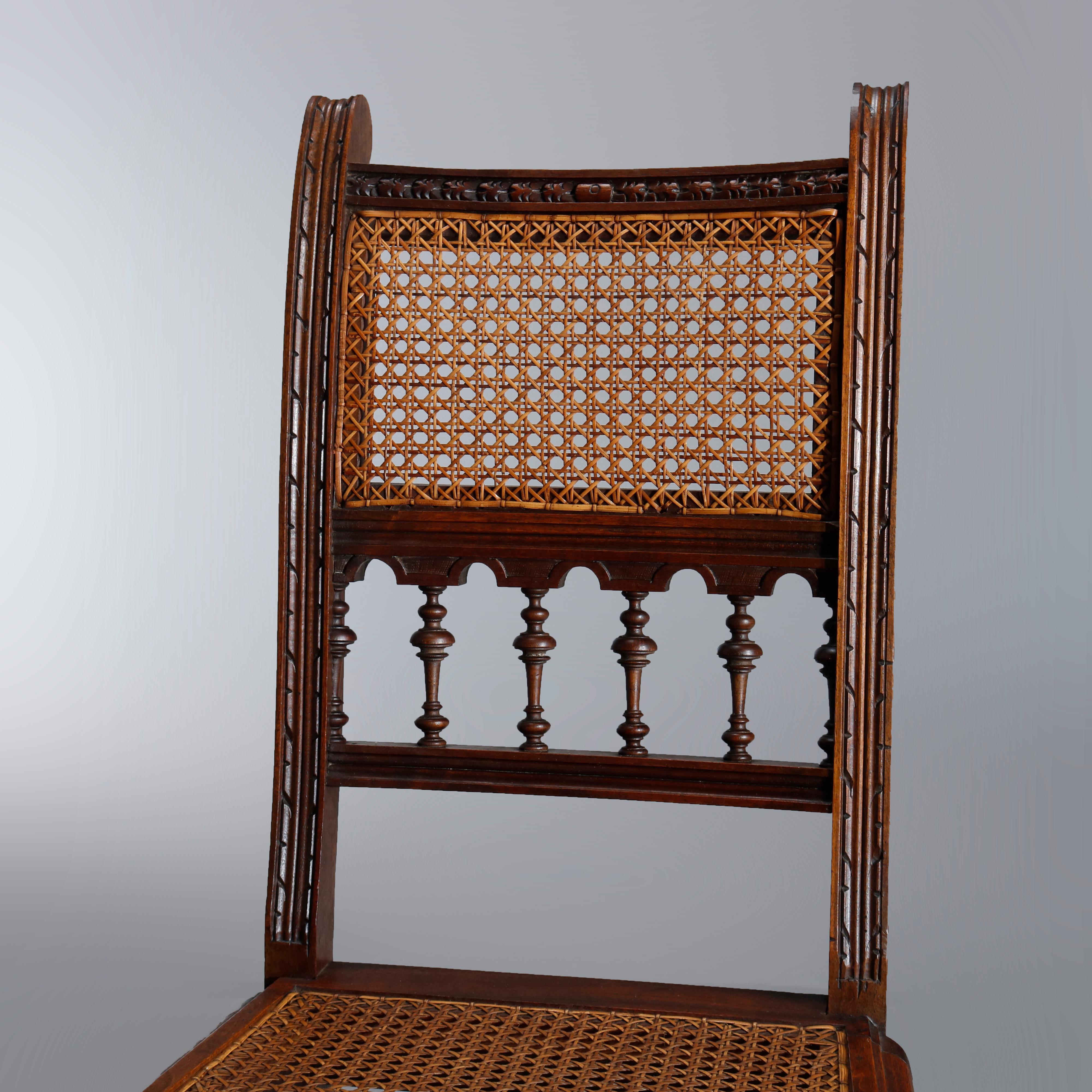 Renaissance Antique Set of Four Italian Carved Walnut and Caned Dining Chairs, circa 1900
