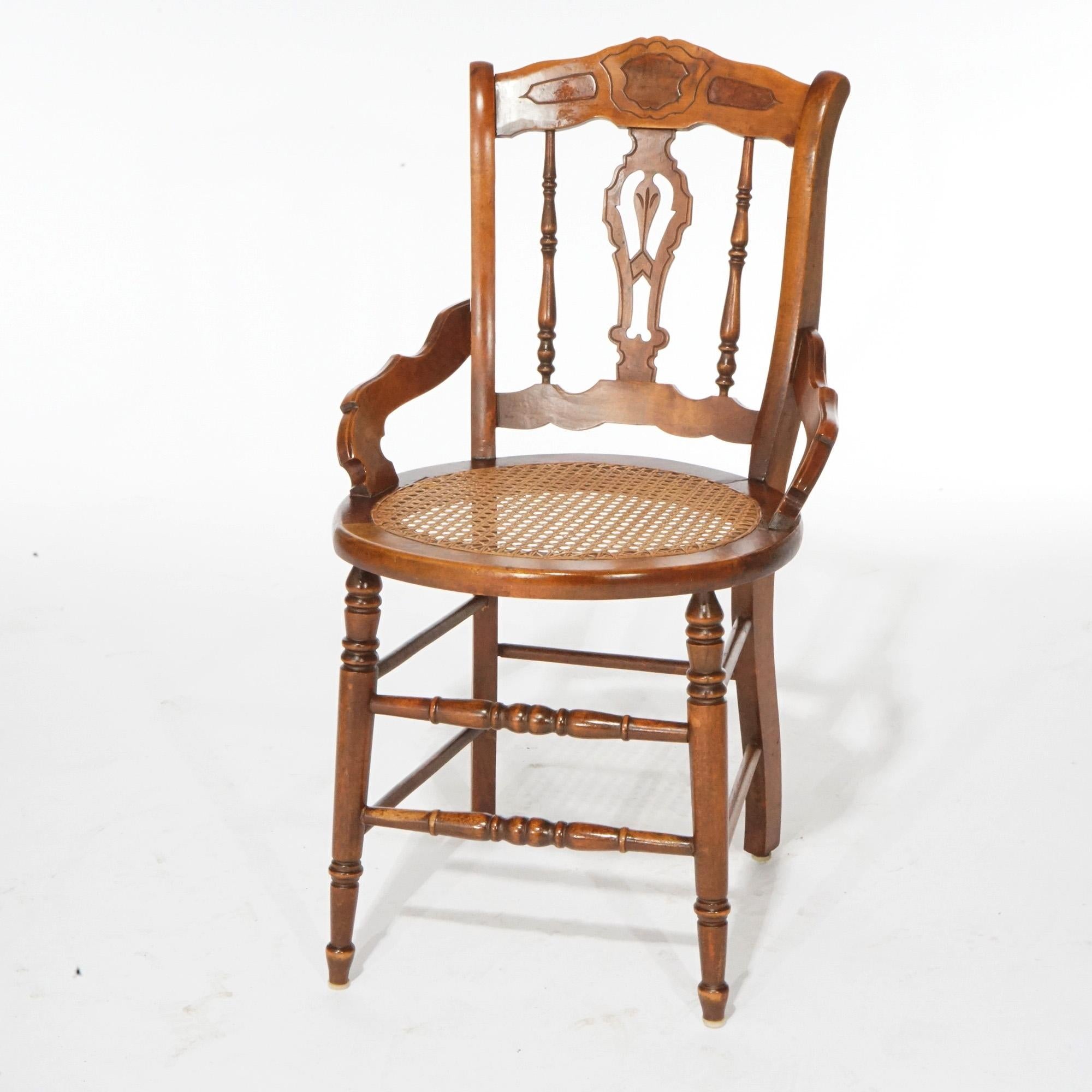 An antique set of four Victorian dining chairs offer walnut construction with shaped rail having burl insets over cane seats and raised on turned legs, c1890.

Measures - 33.75''H x 20''W x 19.75''D; 18.25'' seat height.